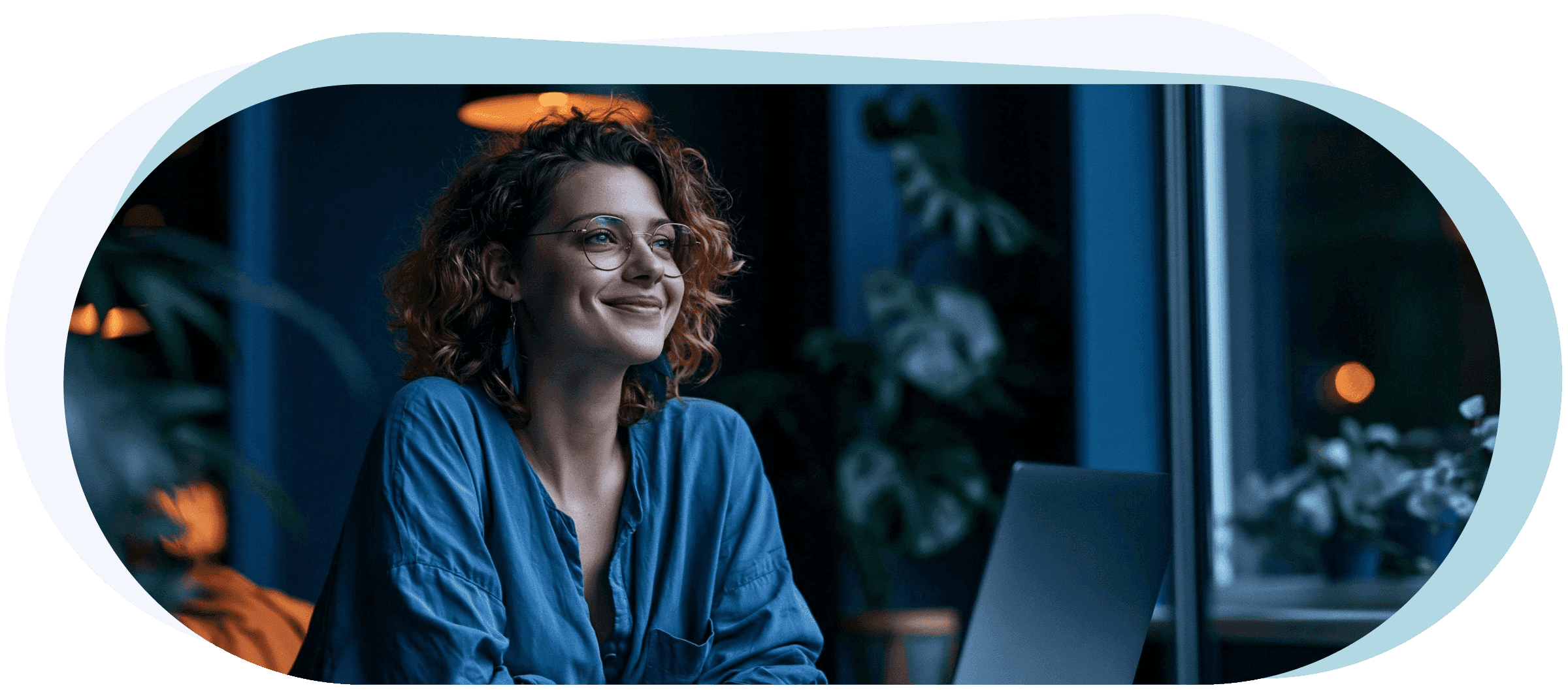 A happy woman, small business owner, smiling with confidence, while sitting at her desk. Feeling super happy and successful thanks to Viber and WhatsApp e-commerce sales (desktop view).
