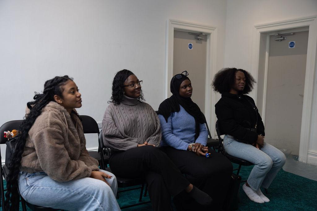 a black and white living room with a large tv