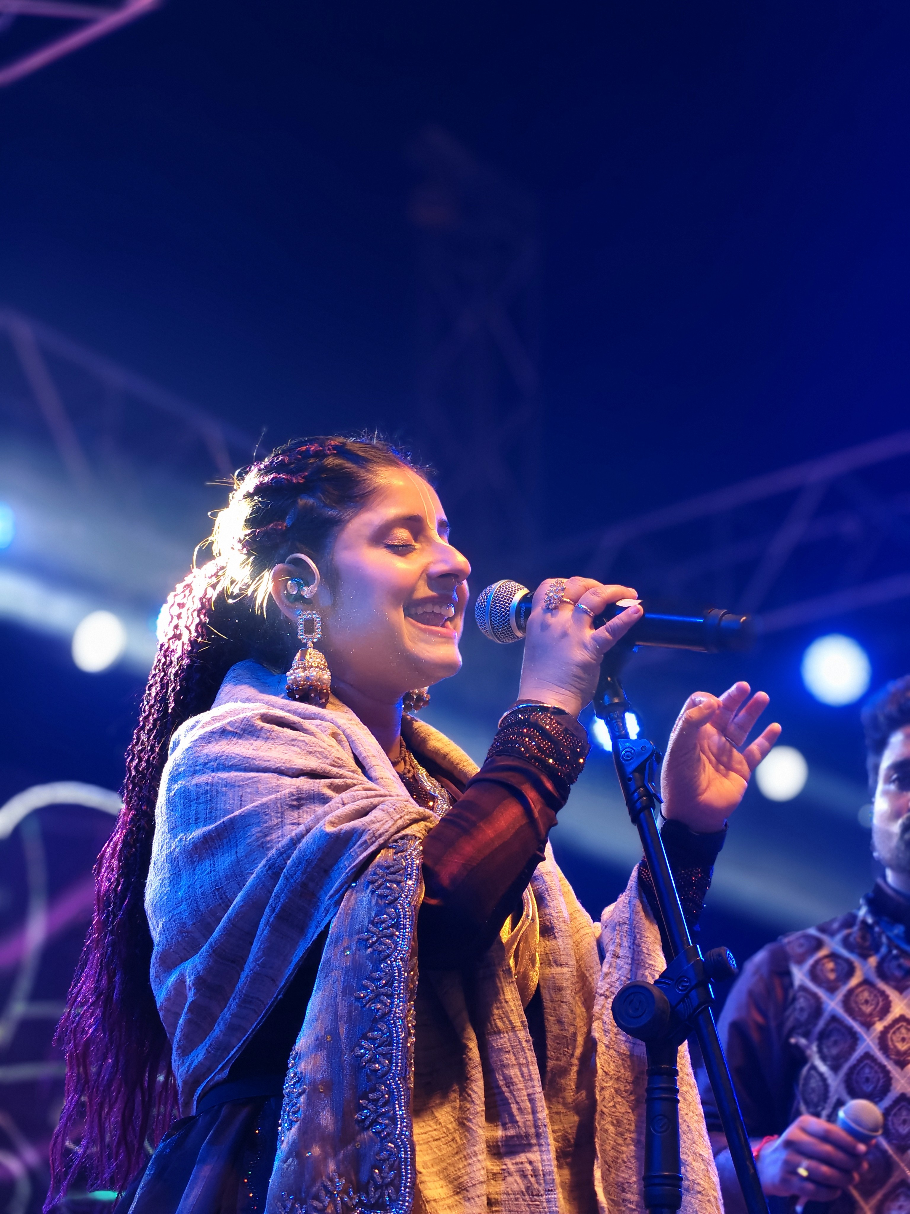 Guitarist performing on stage in silhouette