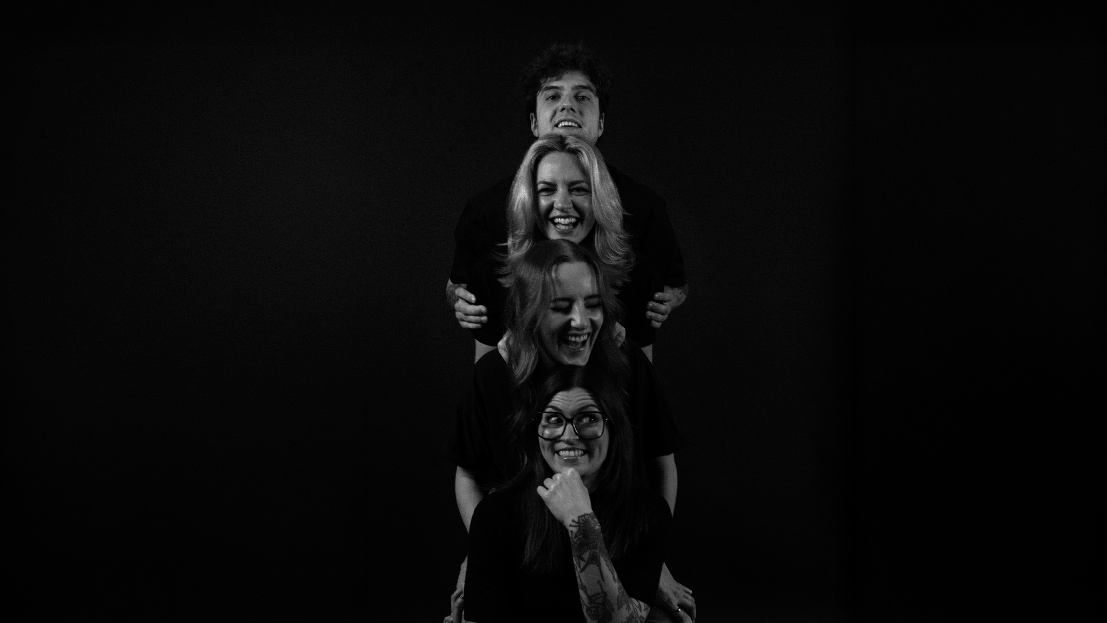 People celebrating, red stickers floating in the air