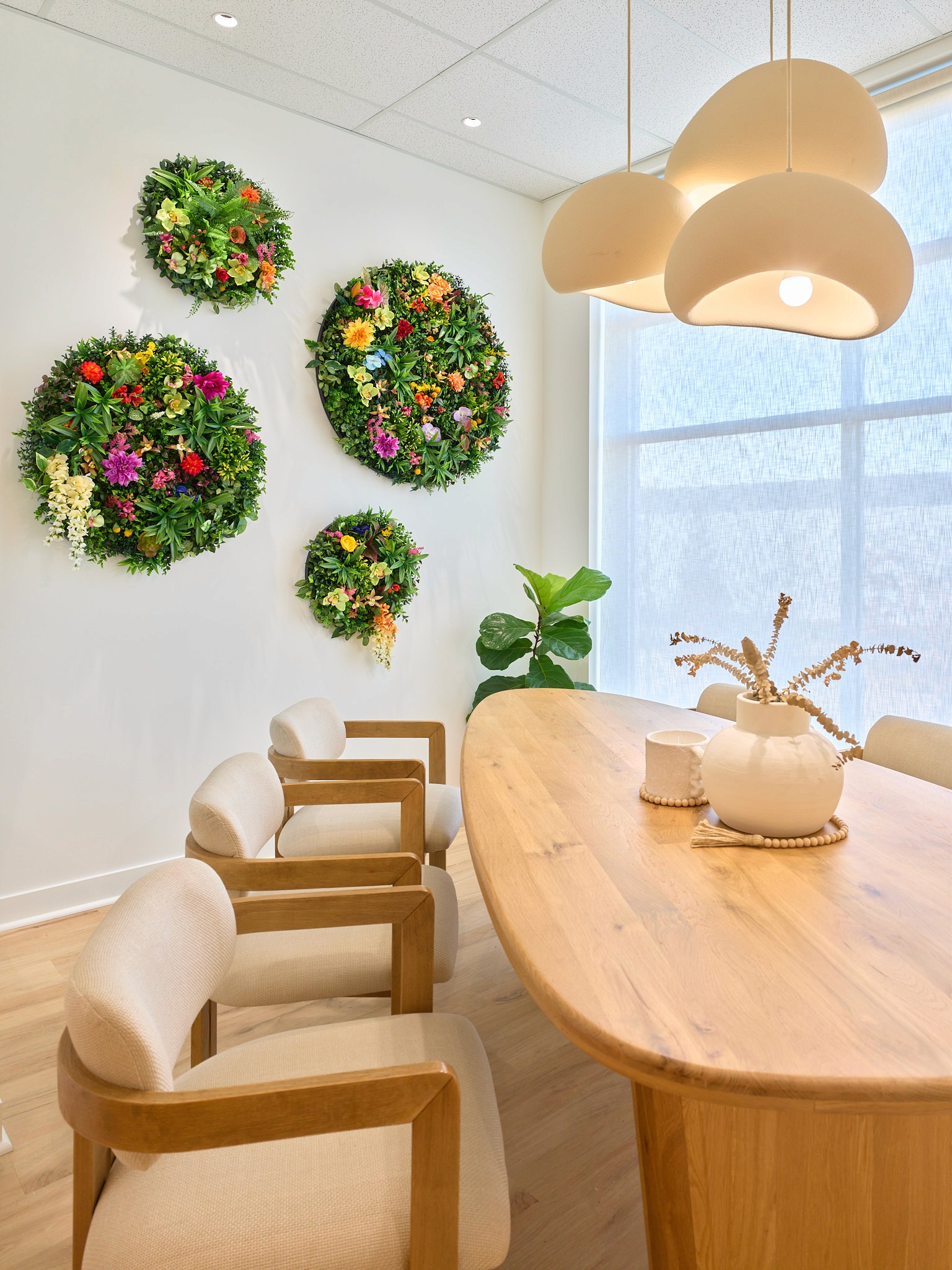 Adanac Sales showroom featuring modern pendant lighting fixtures above a meeting space