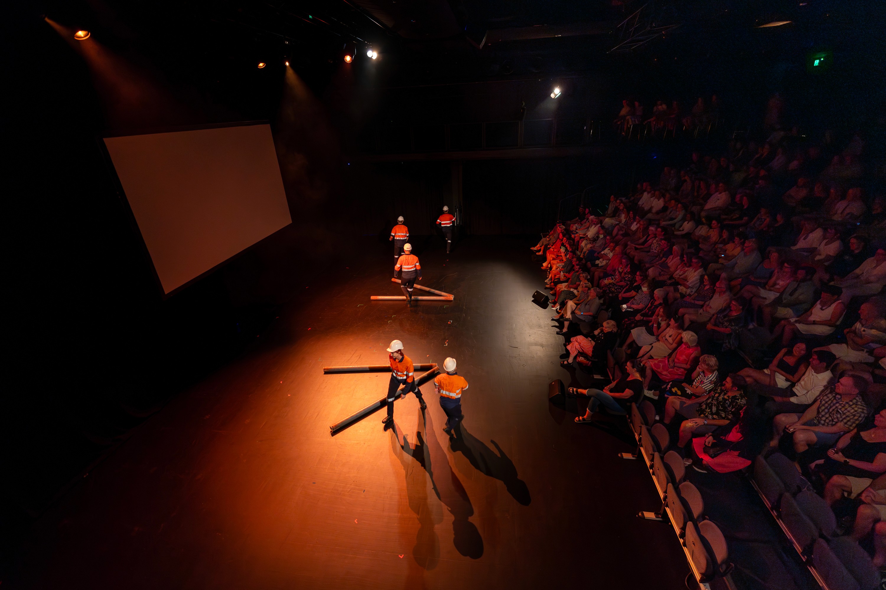 Person, holding a white rose behind his back with one arm on a light blue background