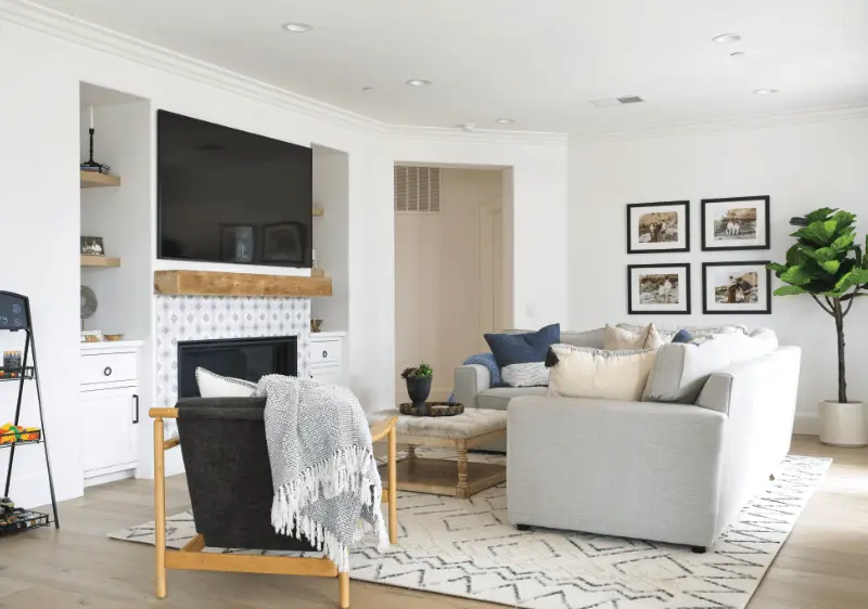 Wide shot of the living room taken from an angle, displaying the room's layout and design in the Dana Point Remodel. Photo by Todd Huge.