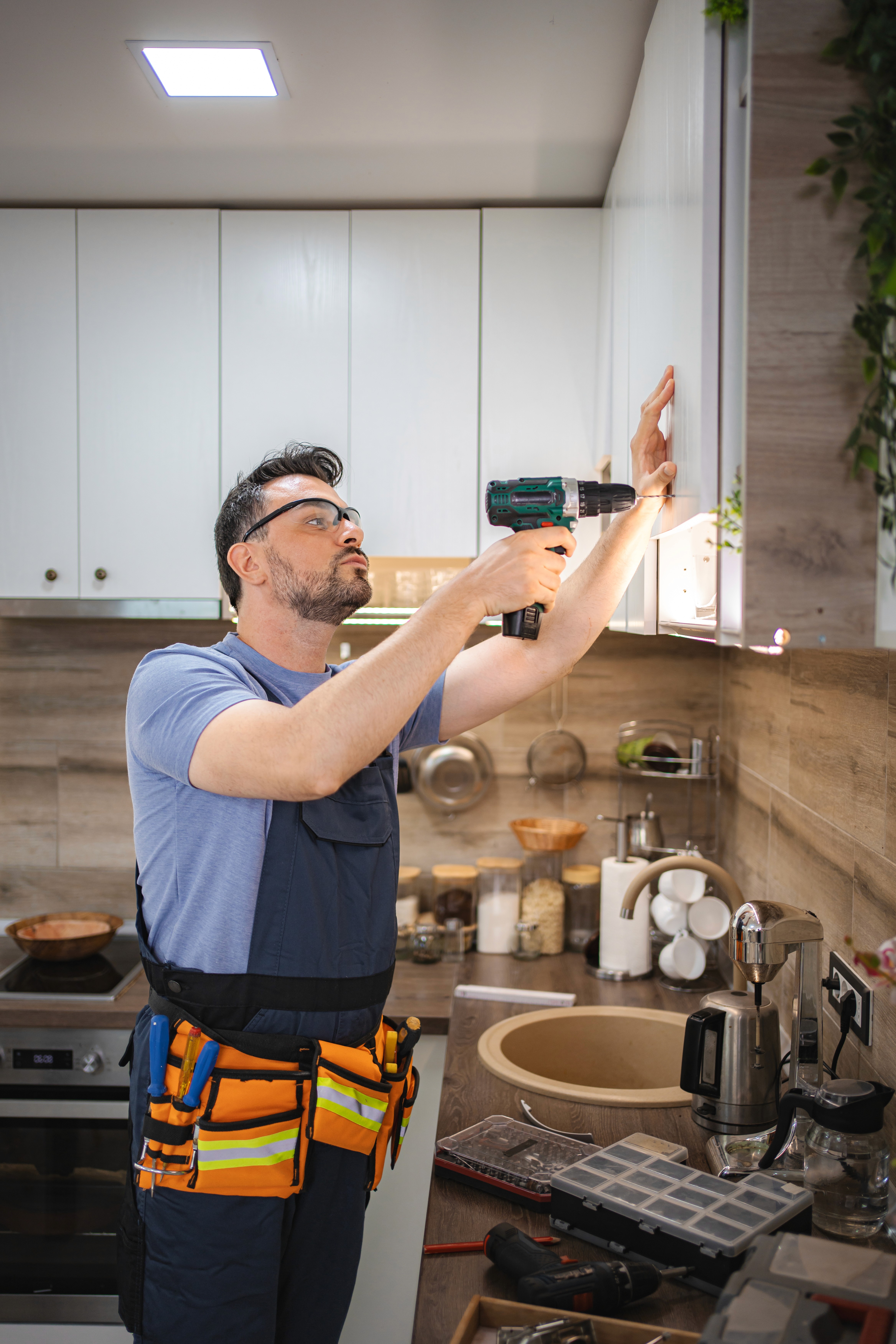 a modern kitchen with a bar and stools