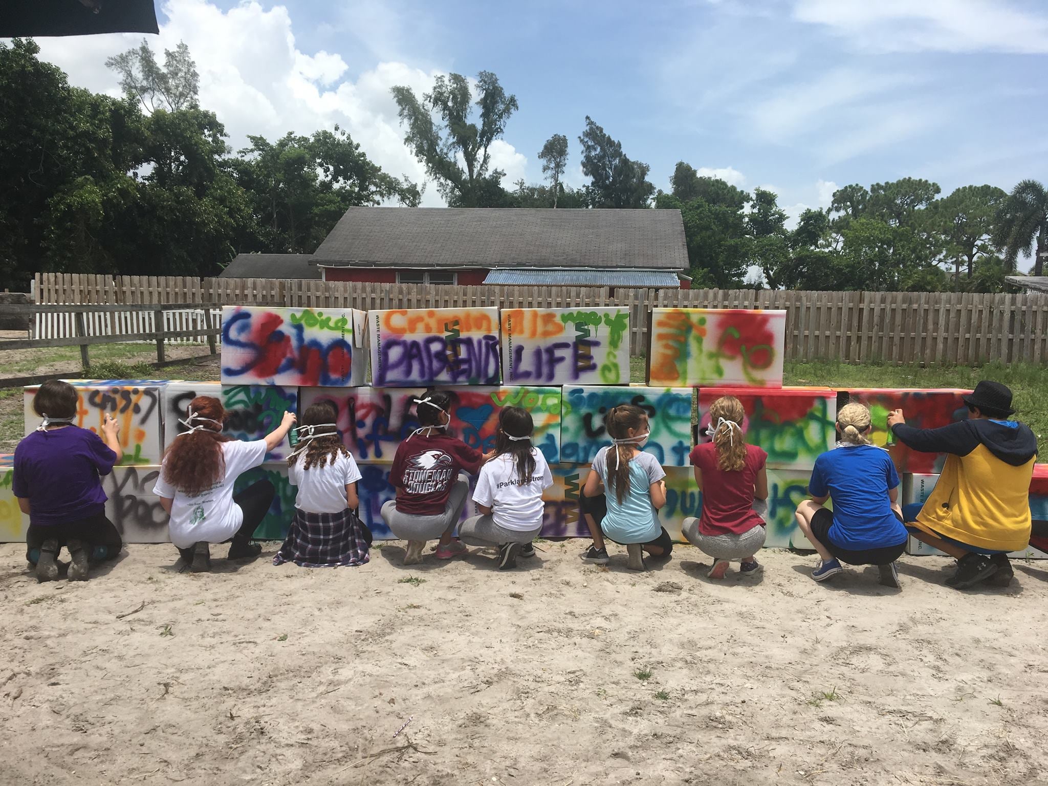 Children making art on the Tomorrow's Rainbow mini ranch