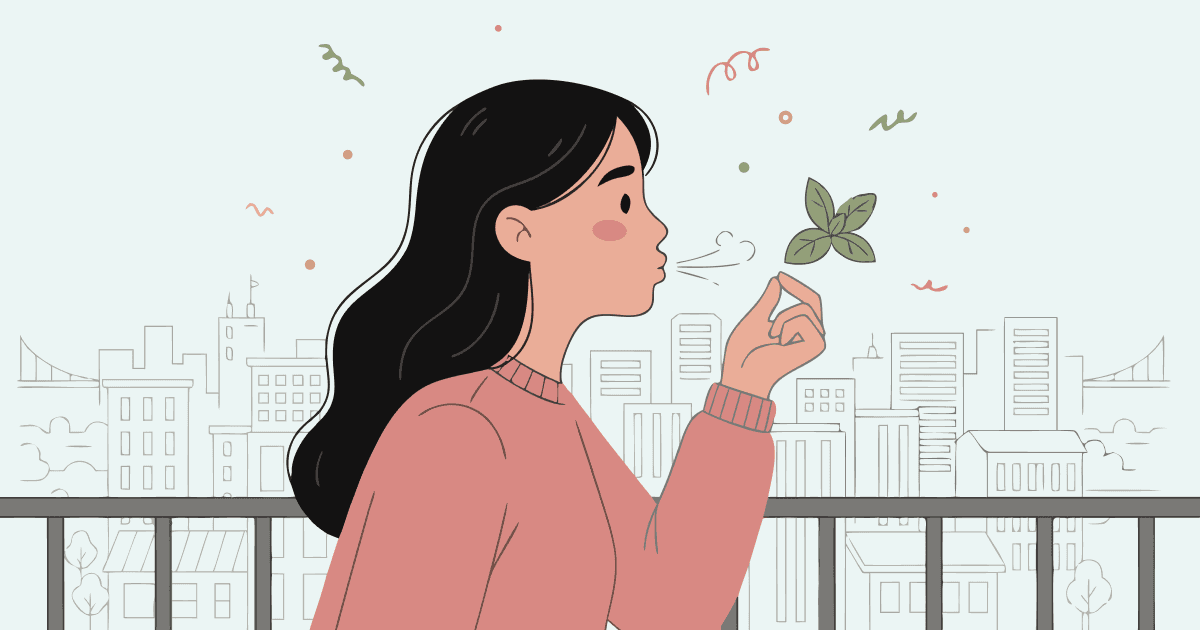 Illustrated young woman shown in profile, facing right, with long black hair and a pink sweater. She holds a small green leafy plant between her fingers close to her lips, blowing a gentle breath toward it. Behind her, a city skyline rendered in thin outline style with buildings, bridges, and trees. Light mint-green background with small scattered hand-drawn doodle marks in coral, sage green, and muted gold. Flat painterly style, variable linework.