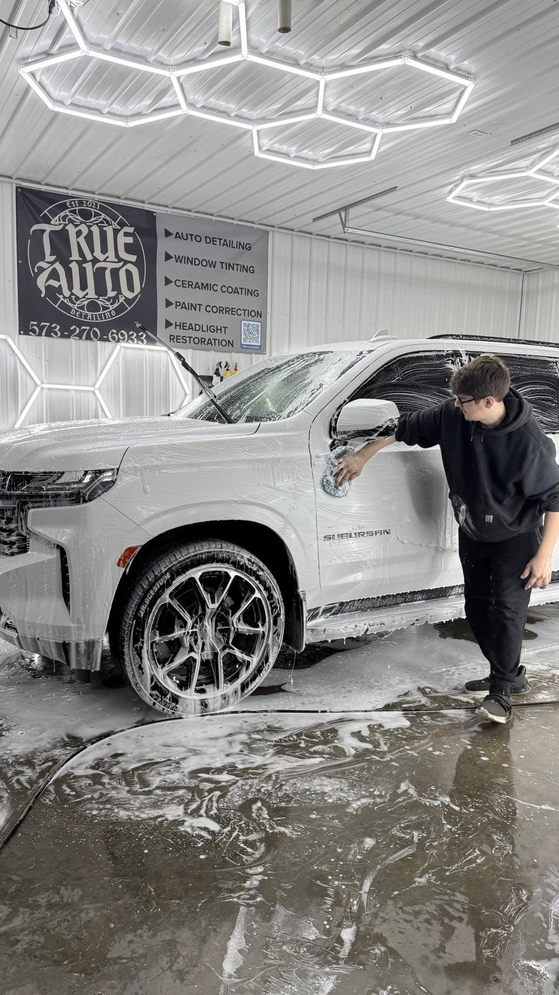 White suburban getting a detail