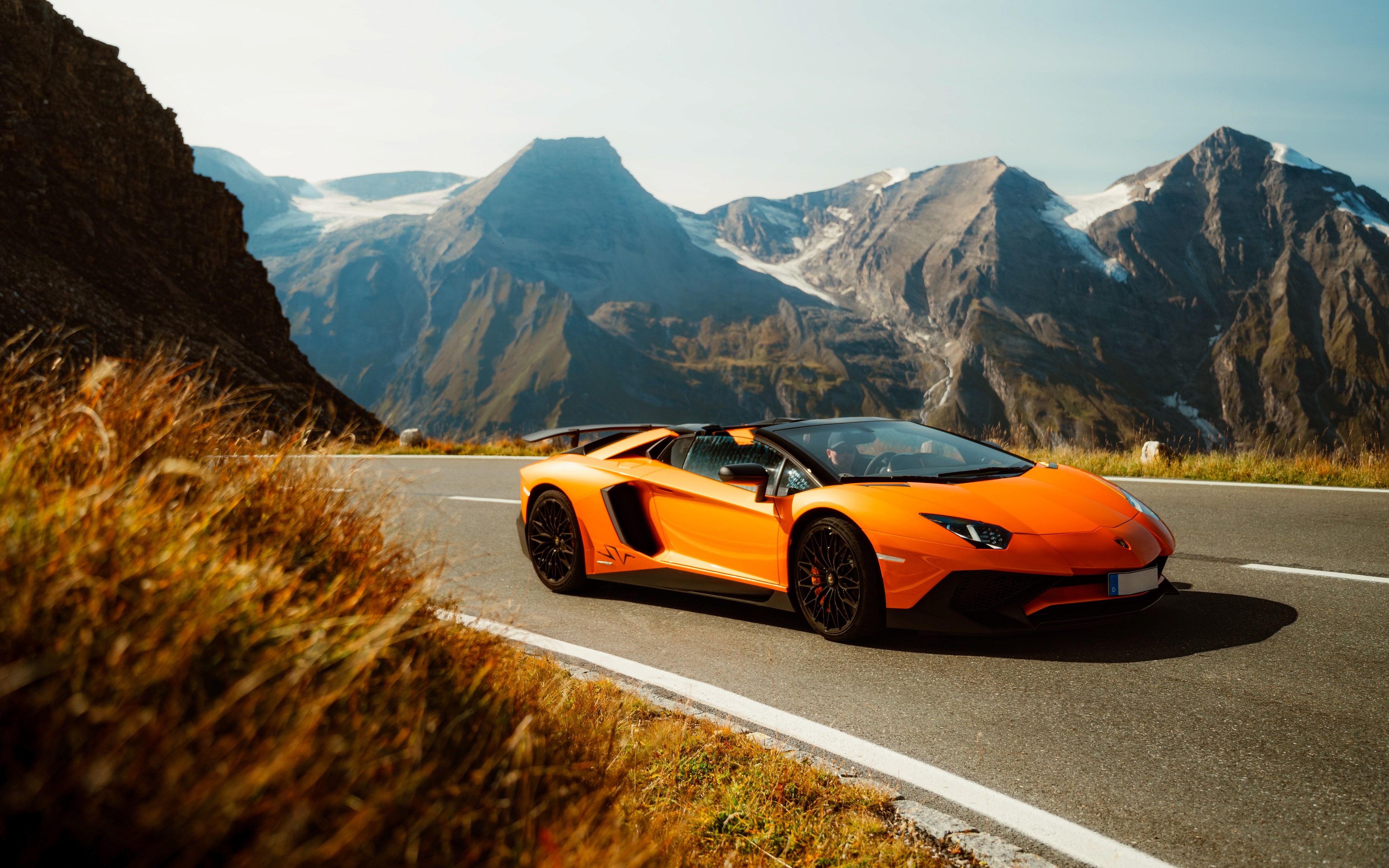 Orange Lambo on mountain road