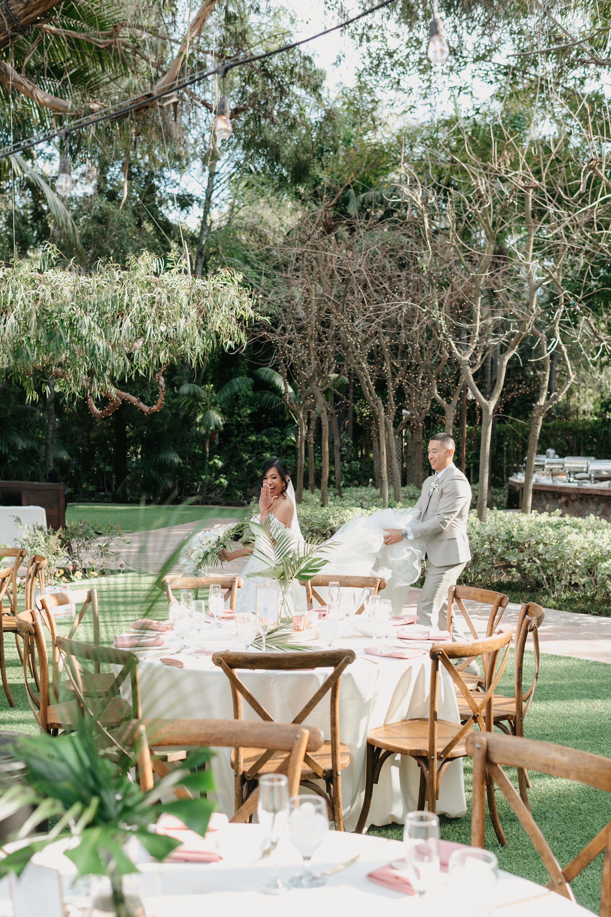 Outdoor wedding reception tablescape under the trees
