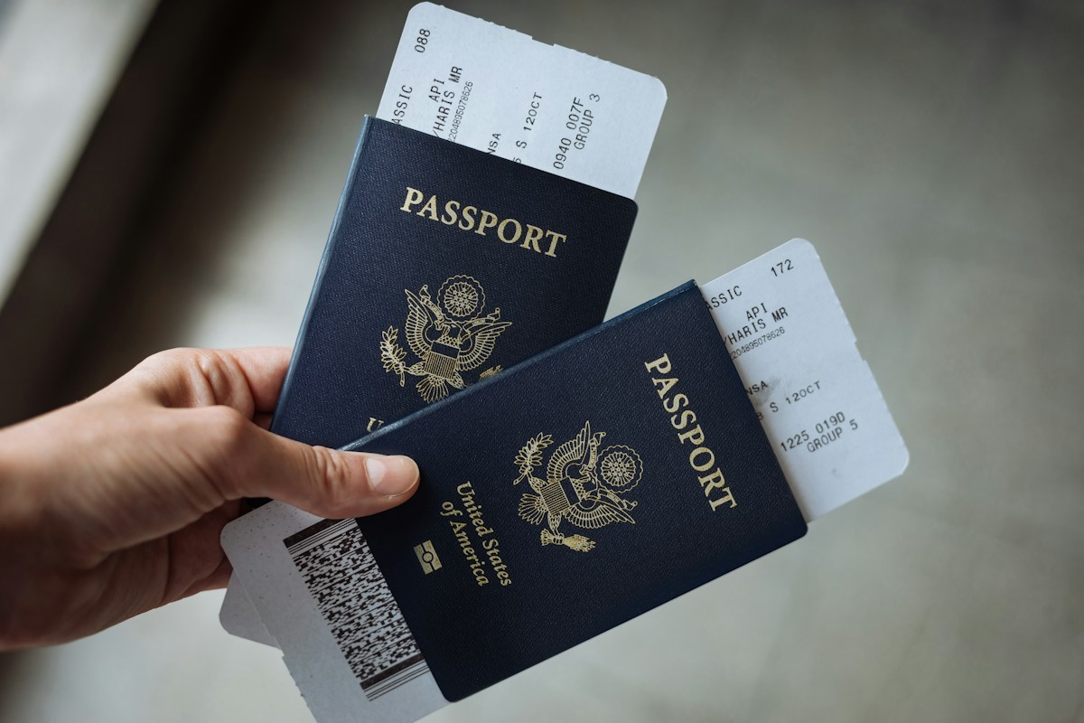Passports and boarding passes held in hand