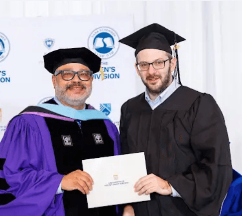 graduates sitting on chair during daytime