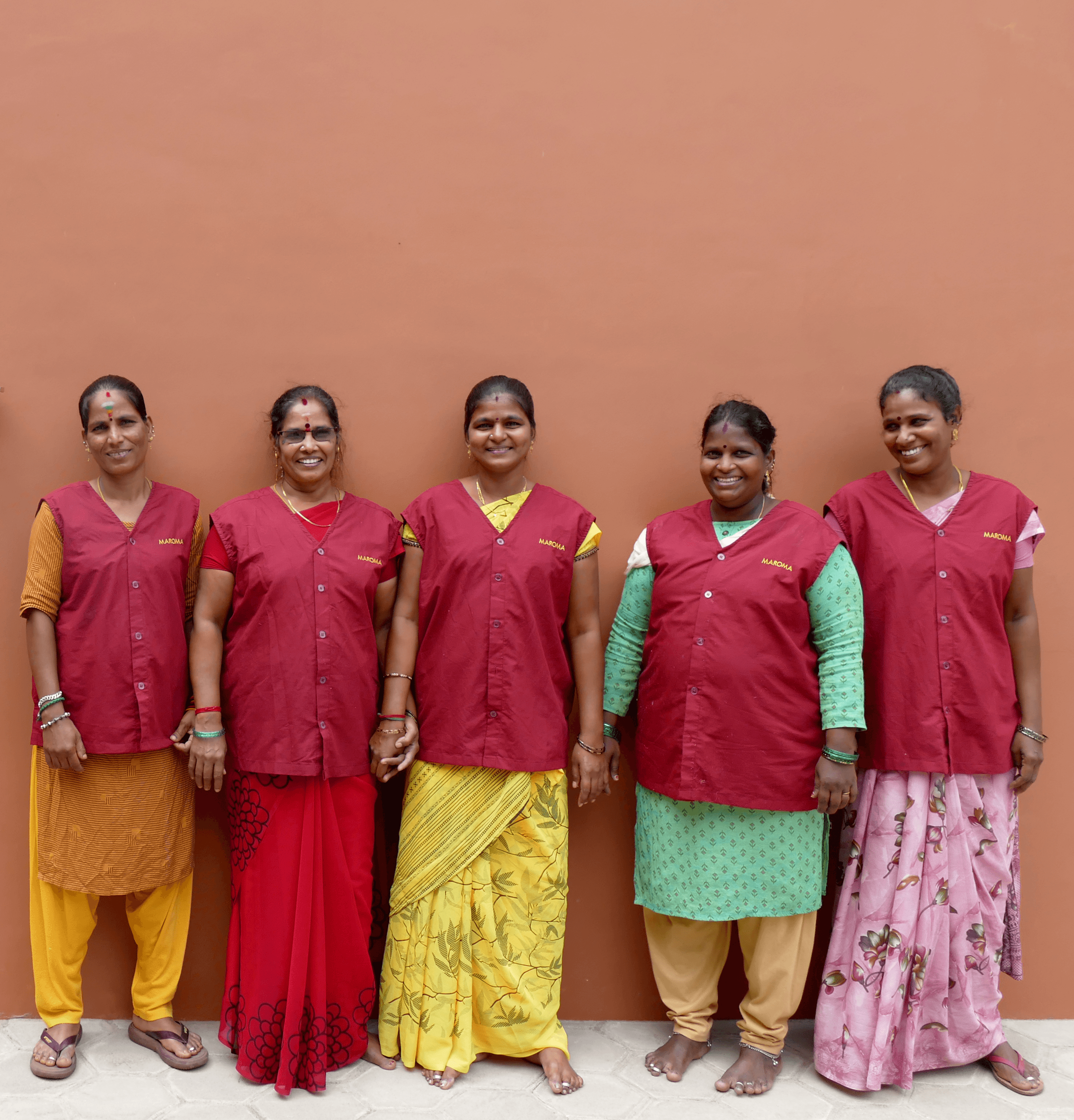 A woman lying down on a soft surface with her eyes closed, bathed in warm sunlight filtering through leaves. Her face has a natural glow, reflecting relaxation and tranquility in a serene spa-like setting.