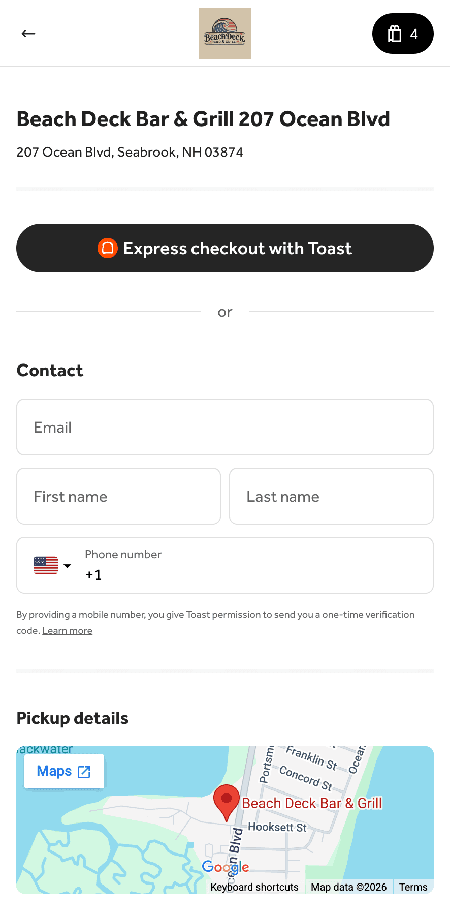 An elephant with large tusks in a lush green landscape.