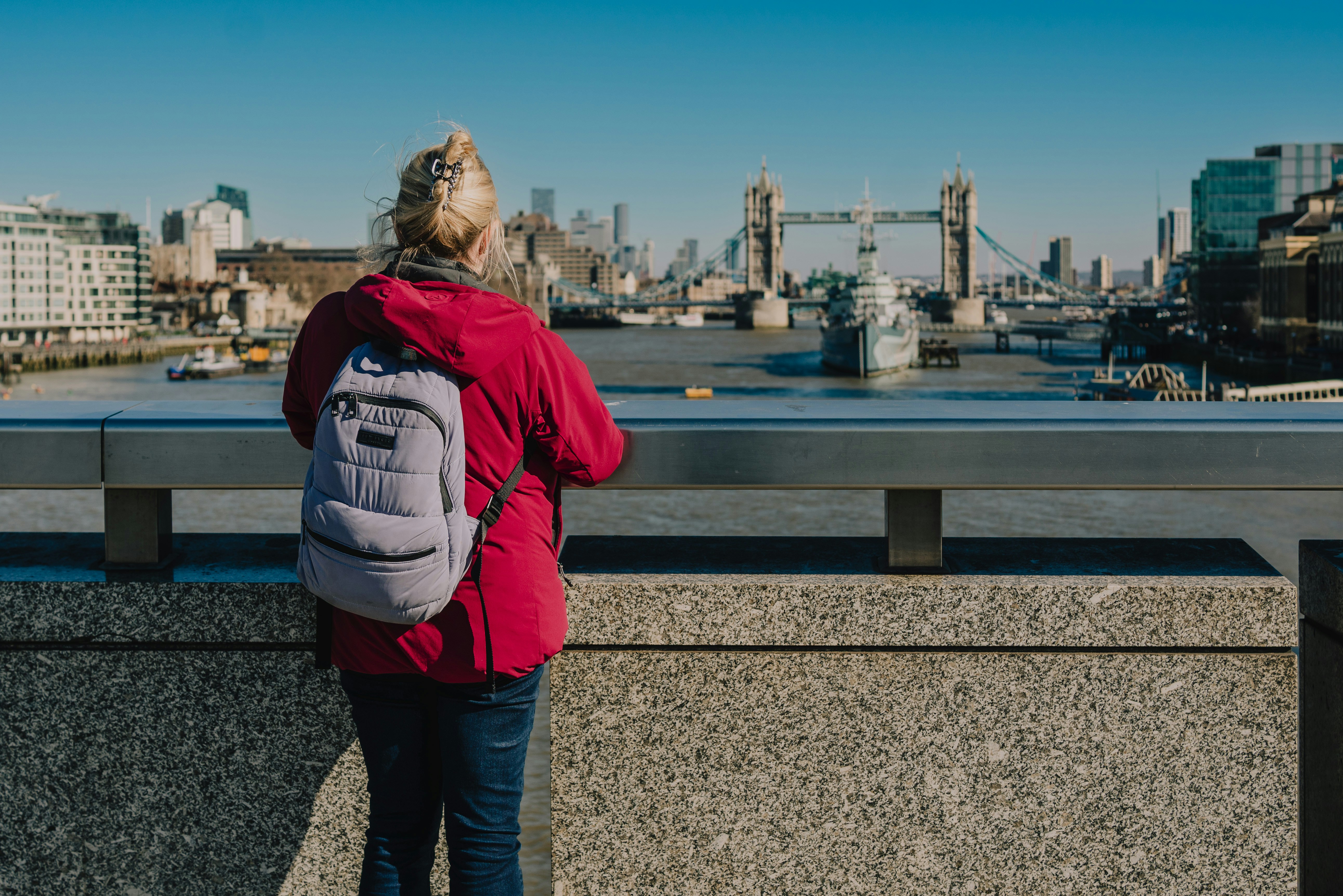 Woman looks out at the london skyline.