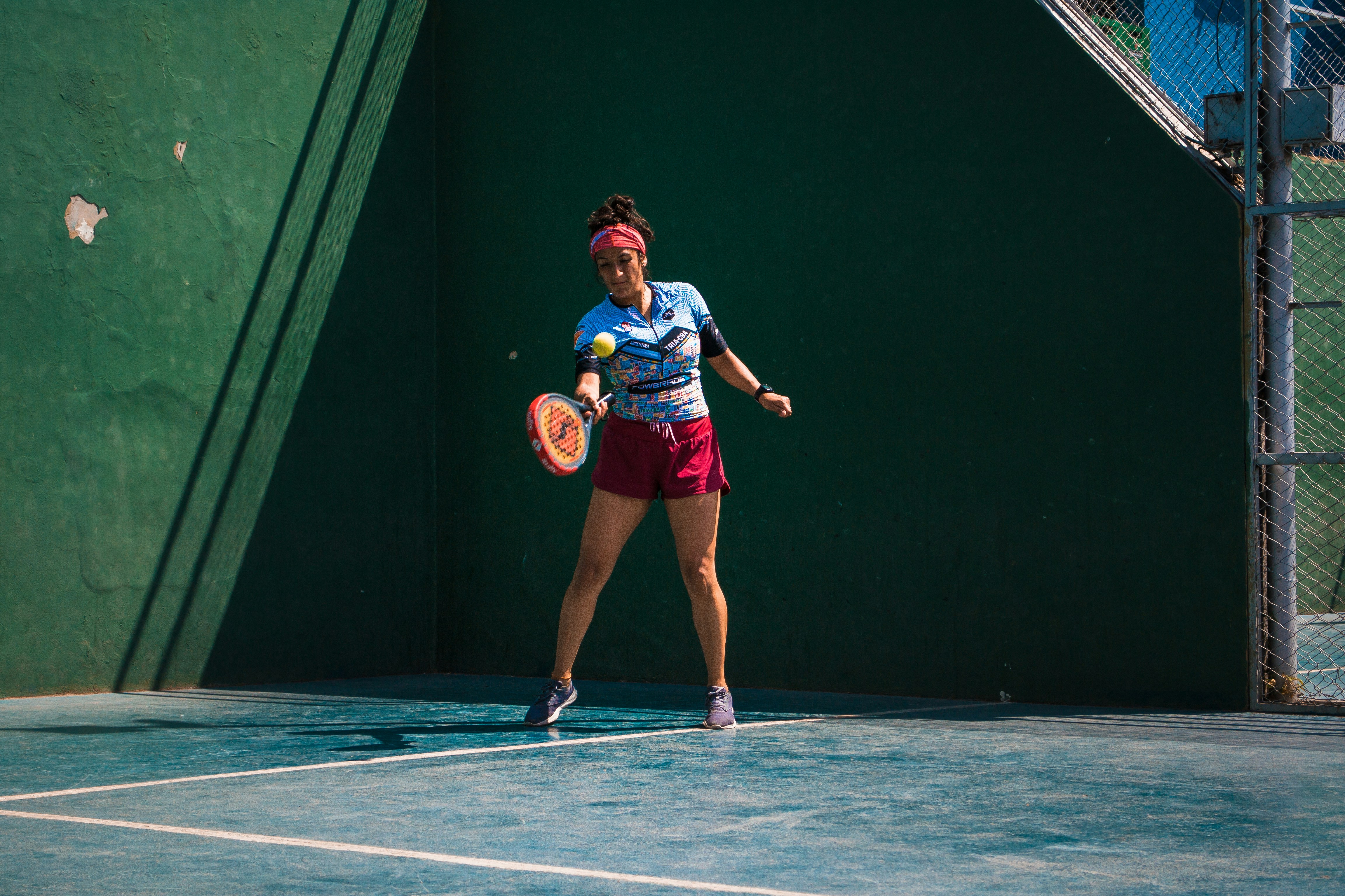 a female tennis player in action on the court