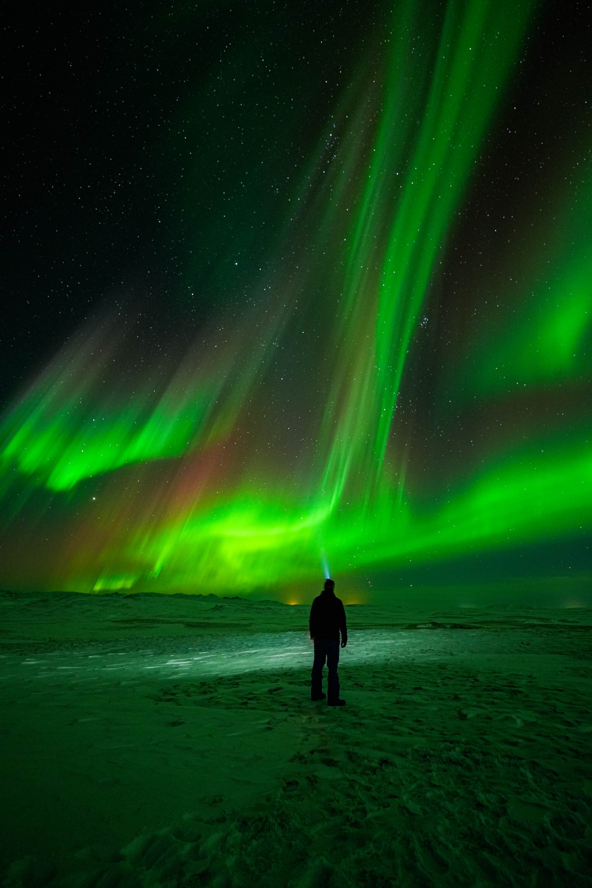 Northern Lights tour photography from Aurora Experts in Iceland, featuring guests beneath the aurora, winter landscapes, and vivid skies over remote Icelandic locations.