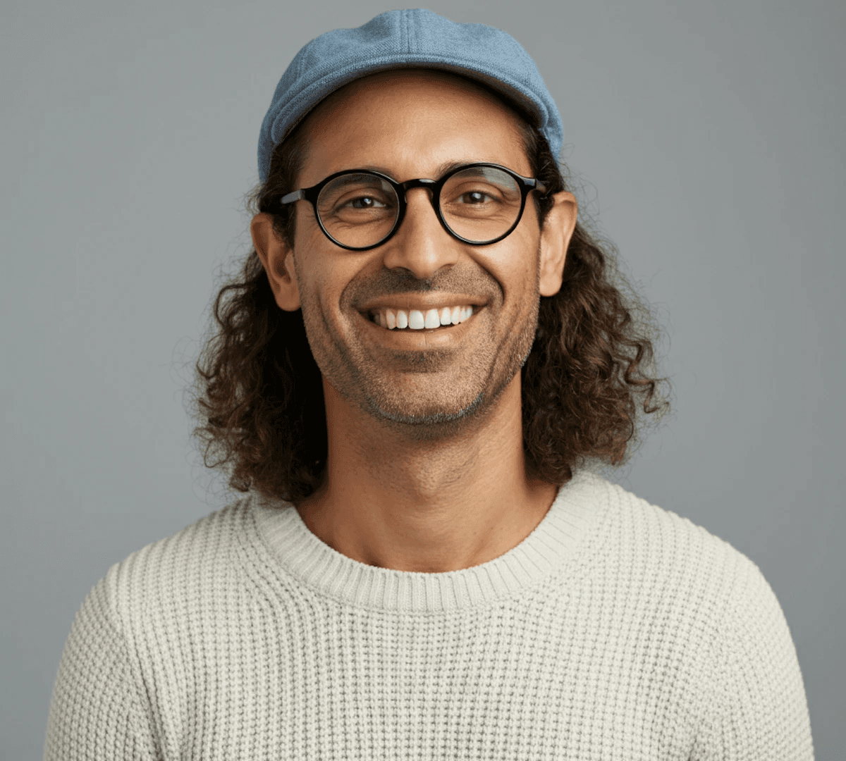 Man in blue coat smiling