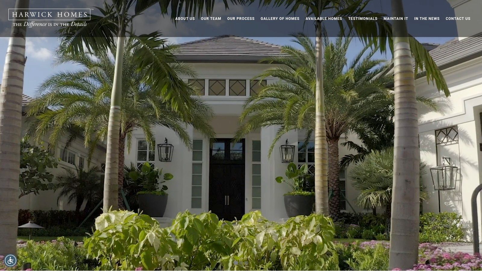 A grand, traditional-style luxury home built by Harwick Homes, featuring a circular driveway, lush landscaping, and classic architectural details.