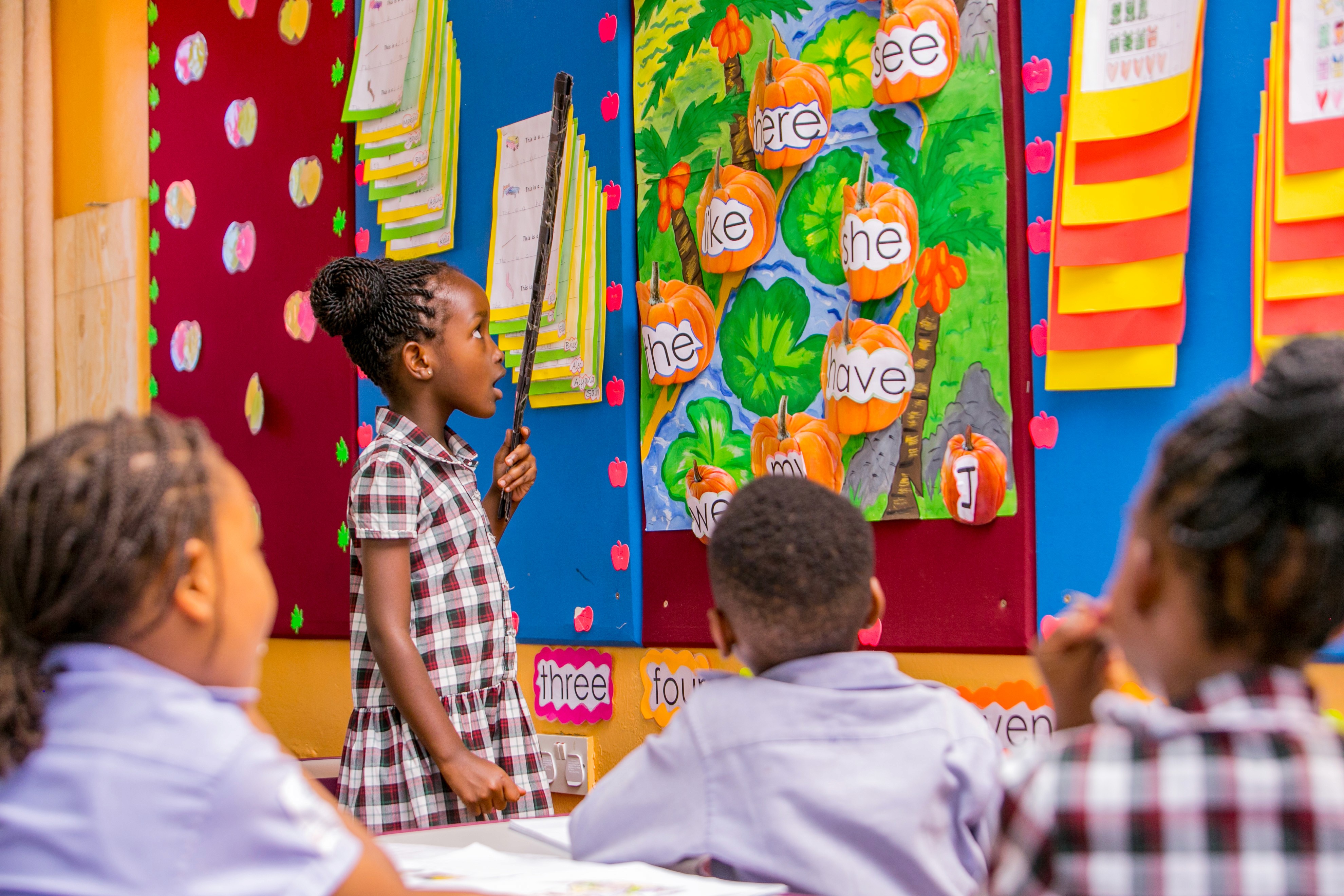 A student is working on a tablet, focused on the screen