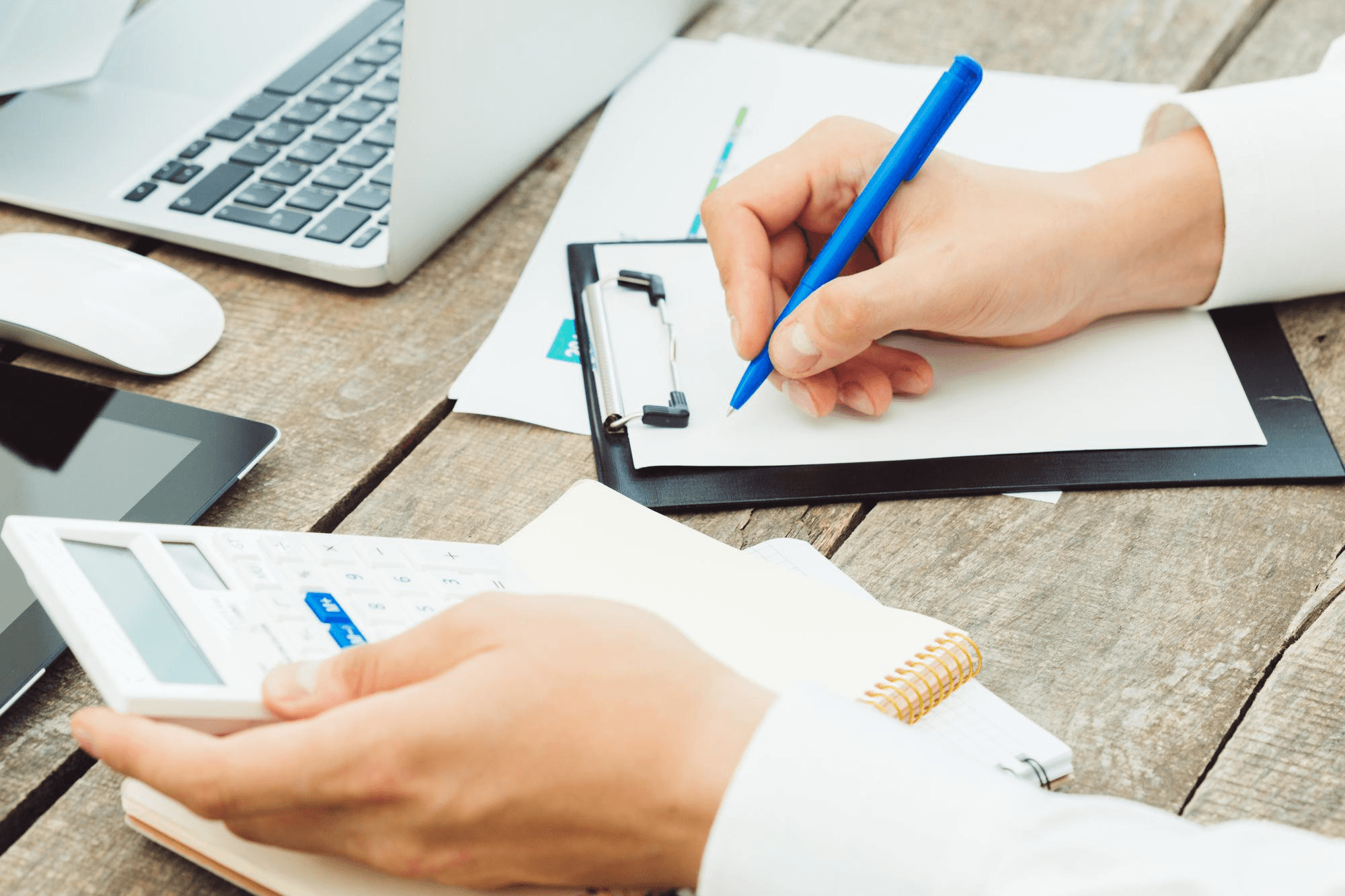 Closeup of employee doing paper checks for payroll disbursement.