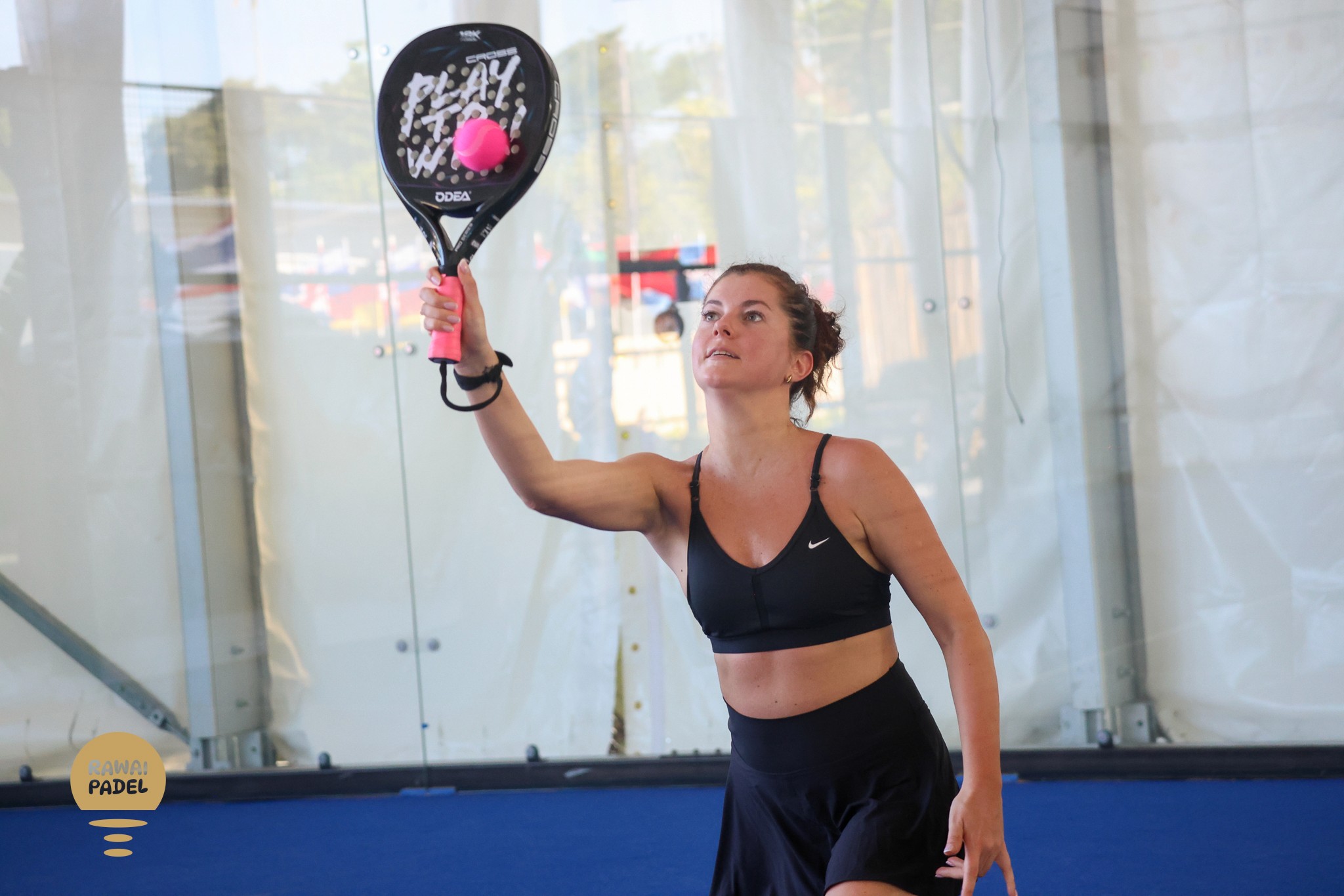 a tennis ball sitting on top of a tennis court