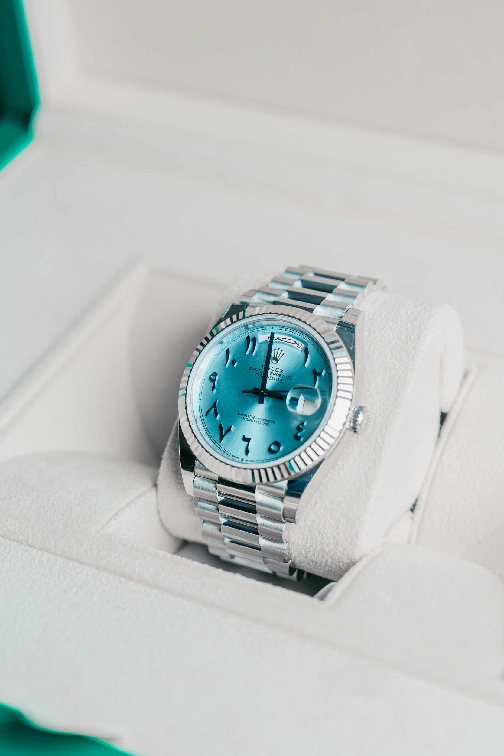 a black watch on a white surface