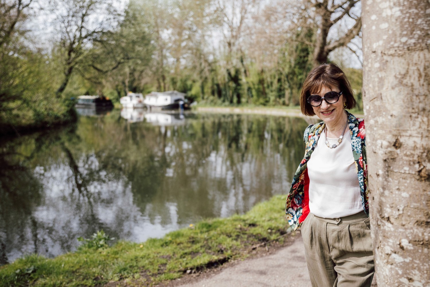 Woman walking alongside canal