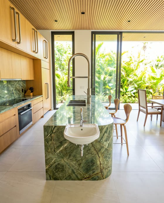 Render de cozinha com uma cuba de banheiro de louça pendurada na lateral da ilha.