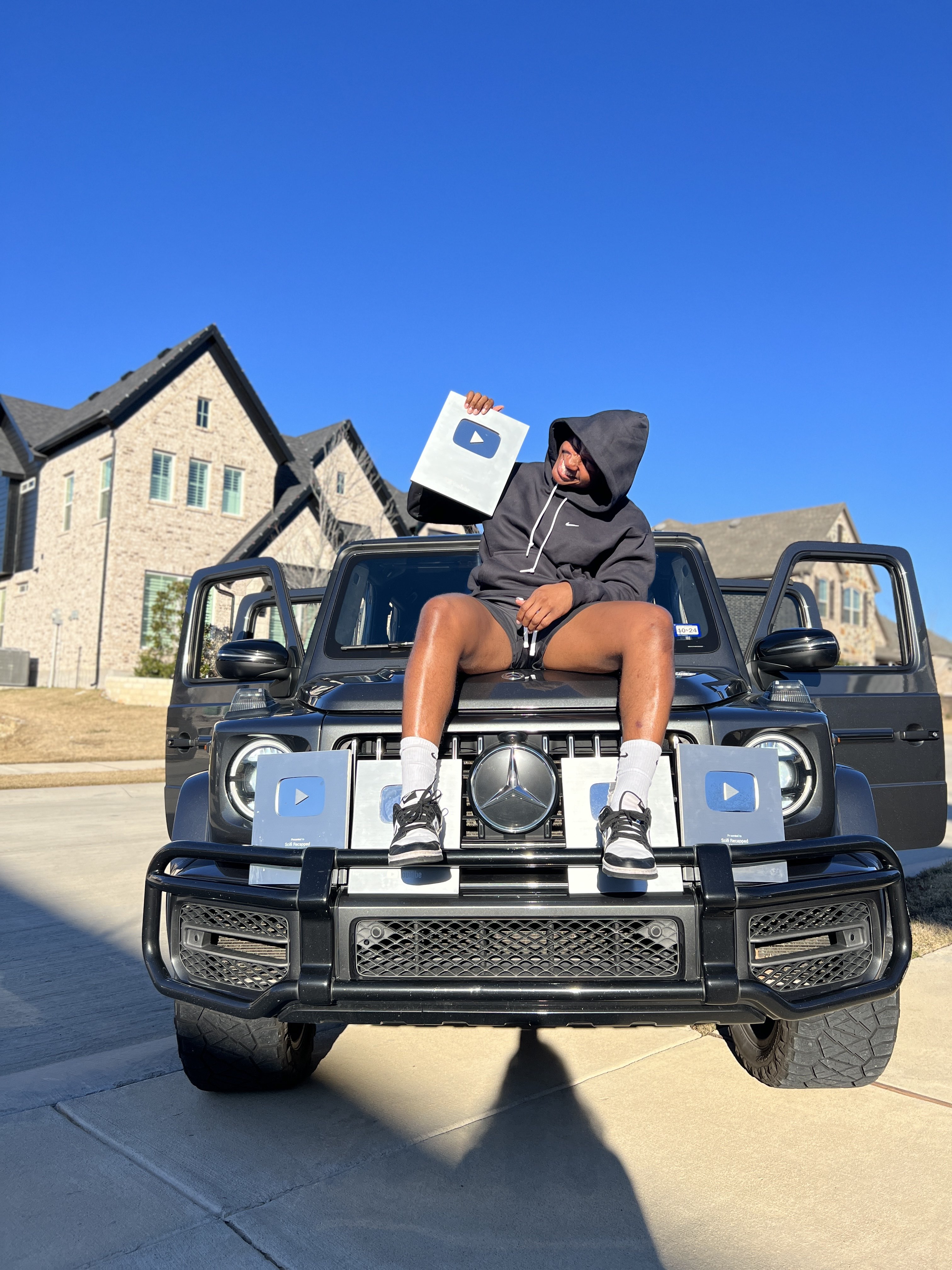 William BeAird Sitting on G-Wagon Car