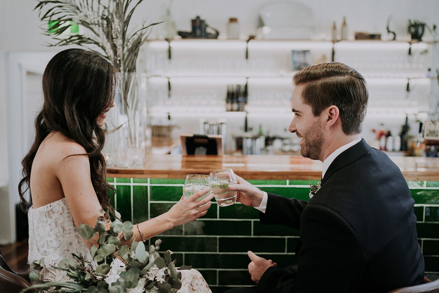 Bride & Groom sharing a drink at the bar before the ceremony