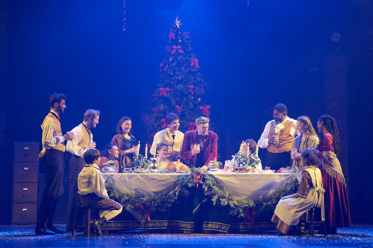 A Christmas Carol festive feast scene with the family celebrating together.