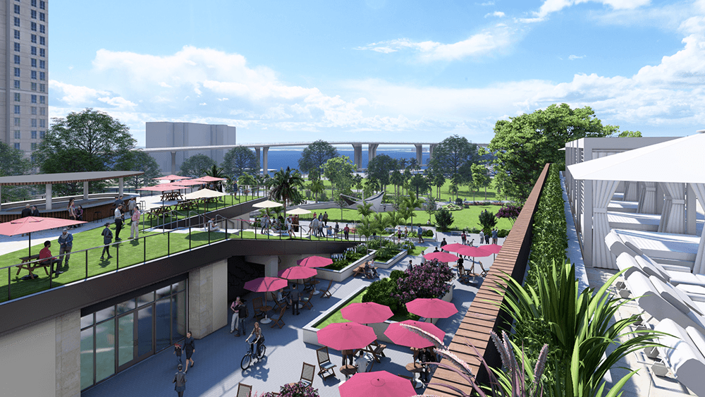 Elevated view of Ballad Hotel rooftop amenity space with lounge chairs, landscaping, and water features overlooking Clearwater