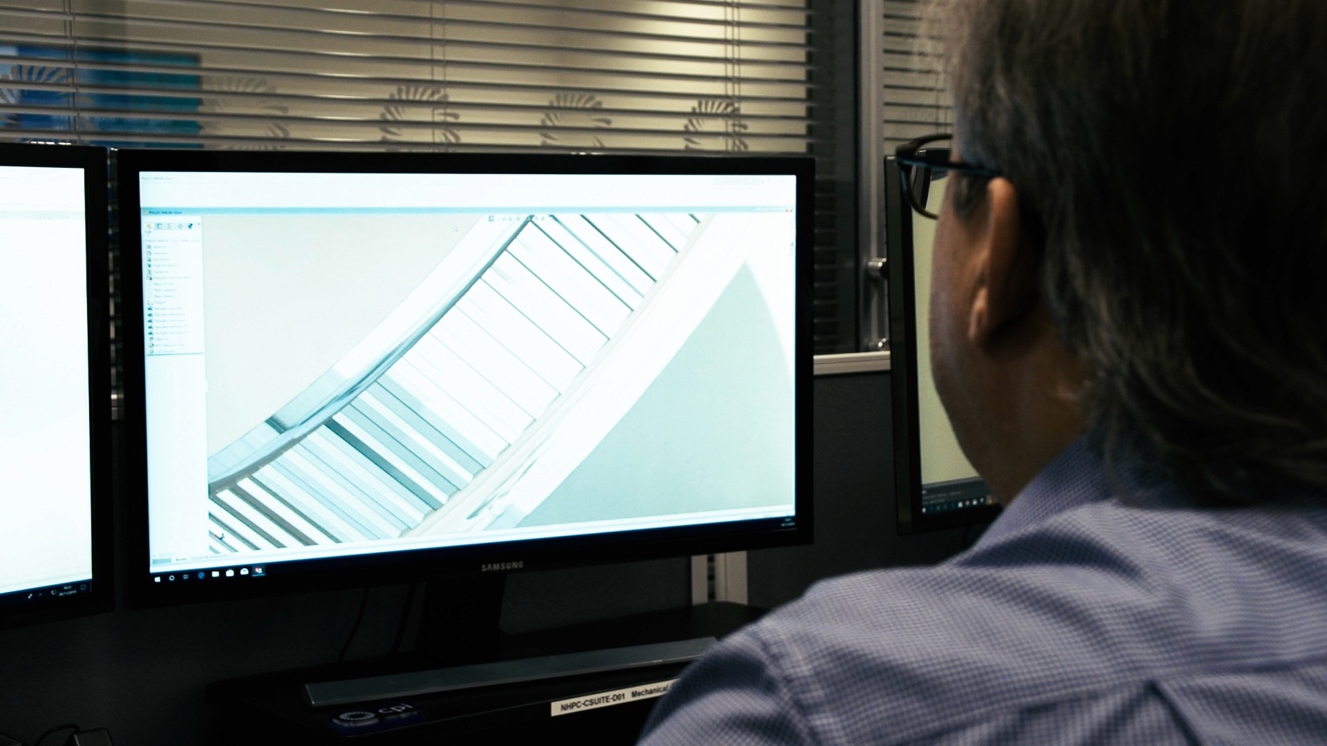 CPI expert looking at a 3D model on a screen.