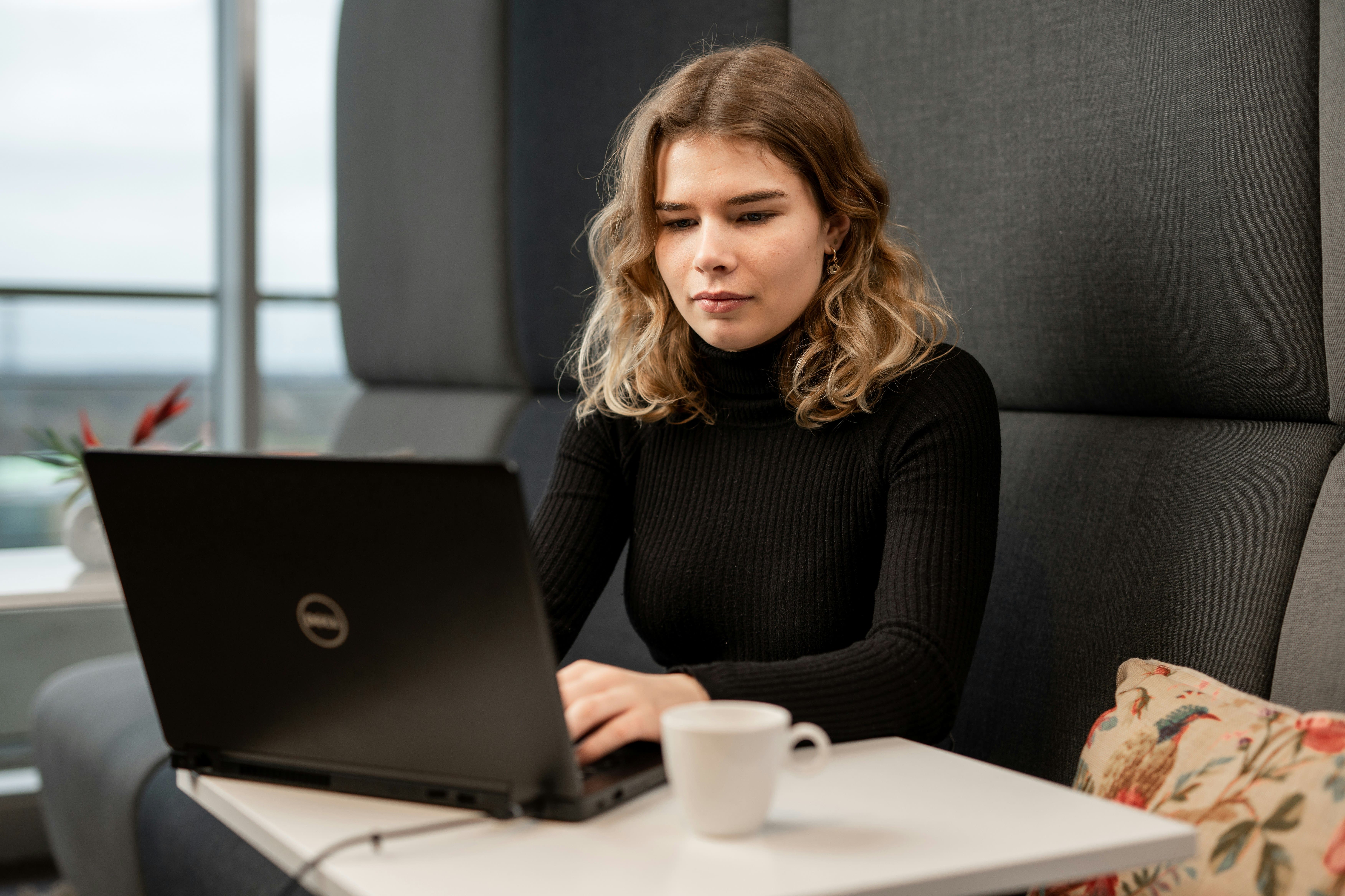 person with laptop infront of her - Research Paper Organizer