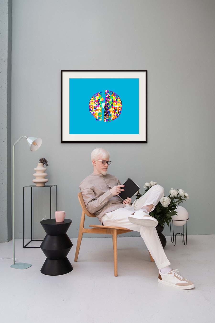 Image of a clean room, chair and painting of an 8bit sphere divided in two revealing an inner orb, titled Orb
