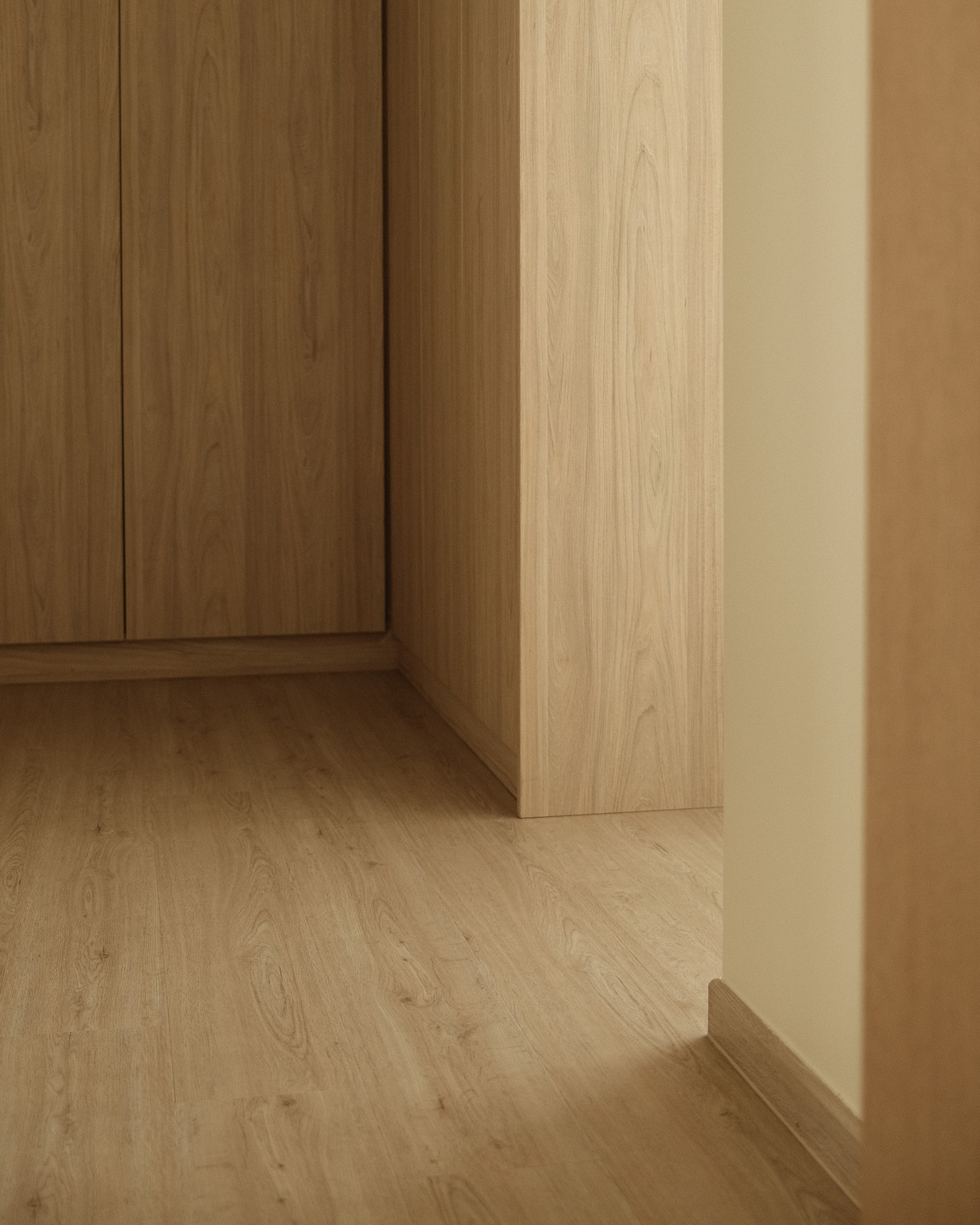 Minimalist entryway with custom built-in cabinetry and light wood finishes, Singapore home renovation by Persqft