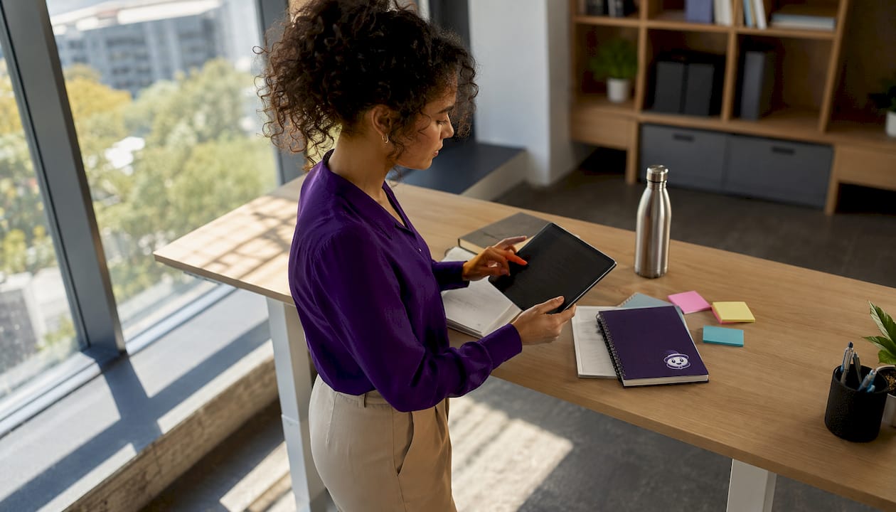 Woman reviewing project management tool on tablet