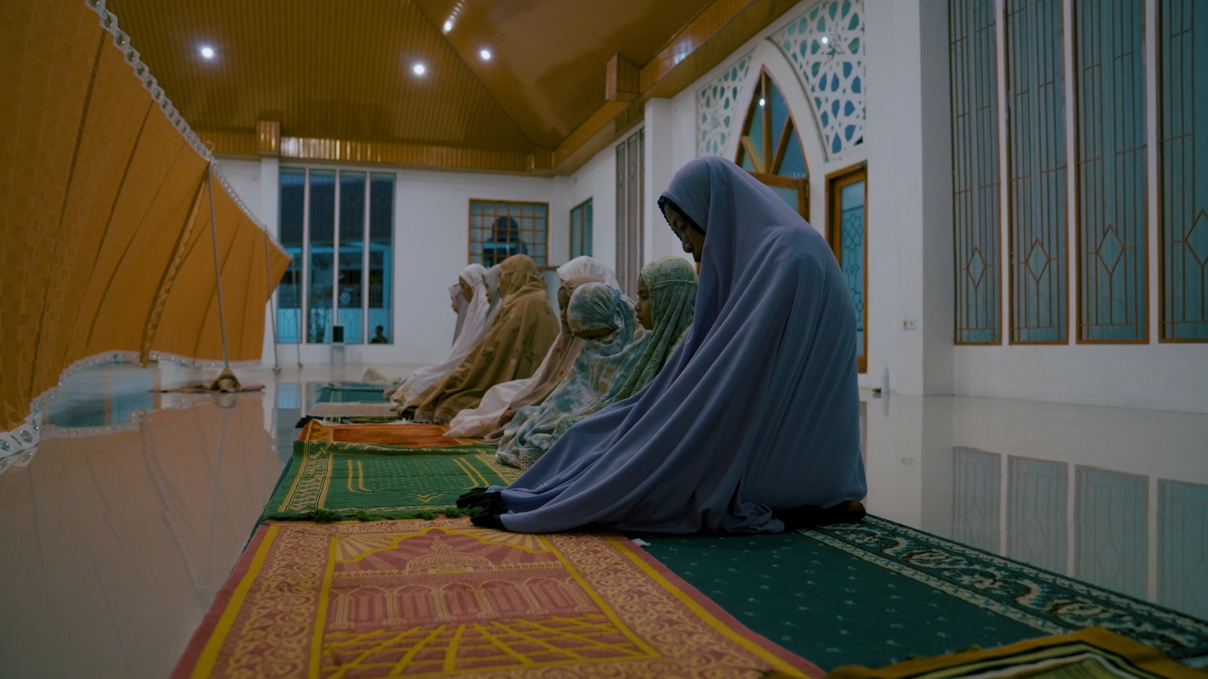 women and children pray as part of a sacred ritual