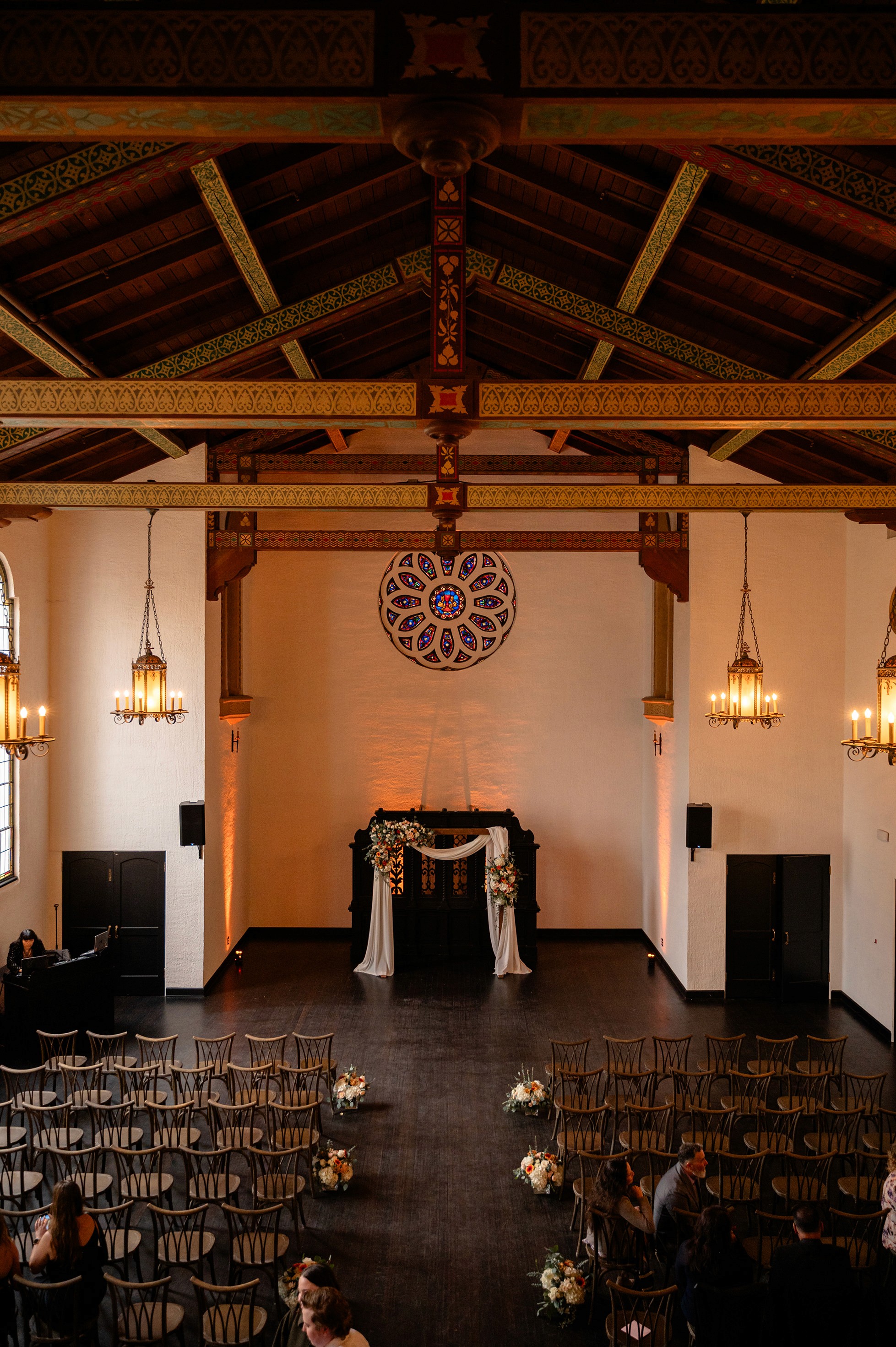 Flat lay wedding details with bouquet, rings, and sparkling bridal heels