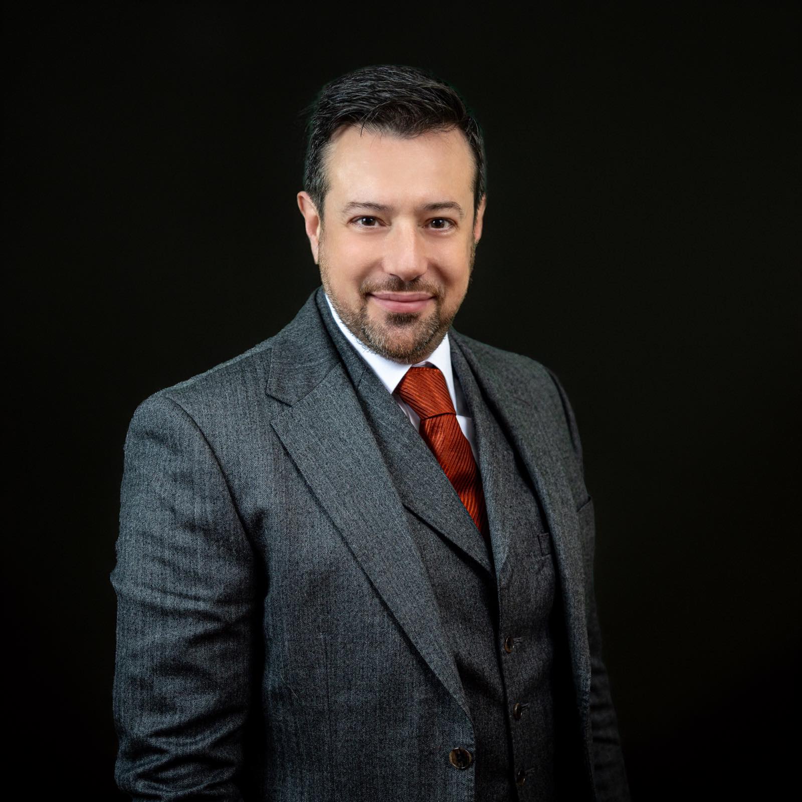 person sitting in a chair in front of a man