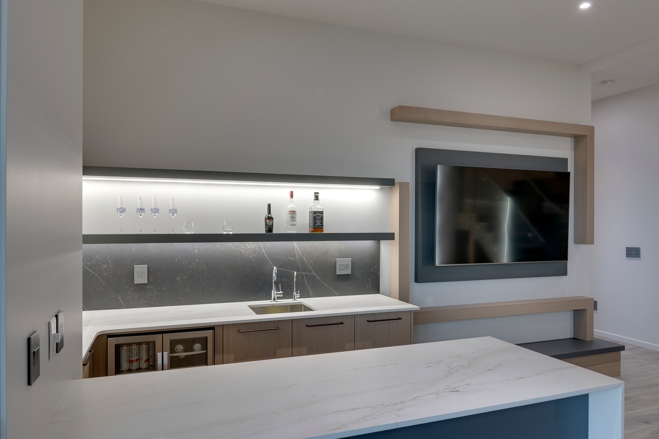 Built-in living room shelving with under-cabinet lighting