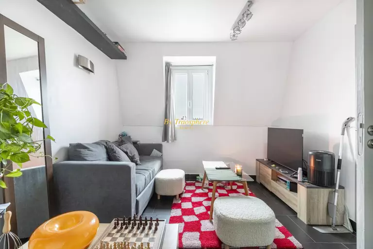 white and brown concrete building near green trees during daytime