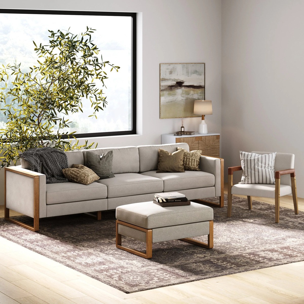 Nathan James Madison modern 3-seater sofa with exposed wood frame and neutral upholstery in a bright, open space