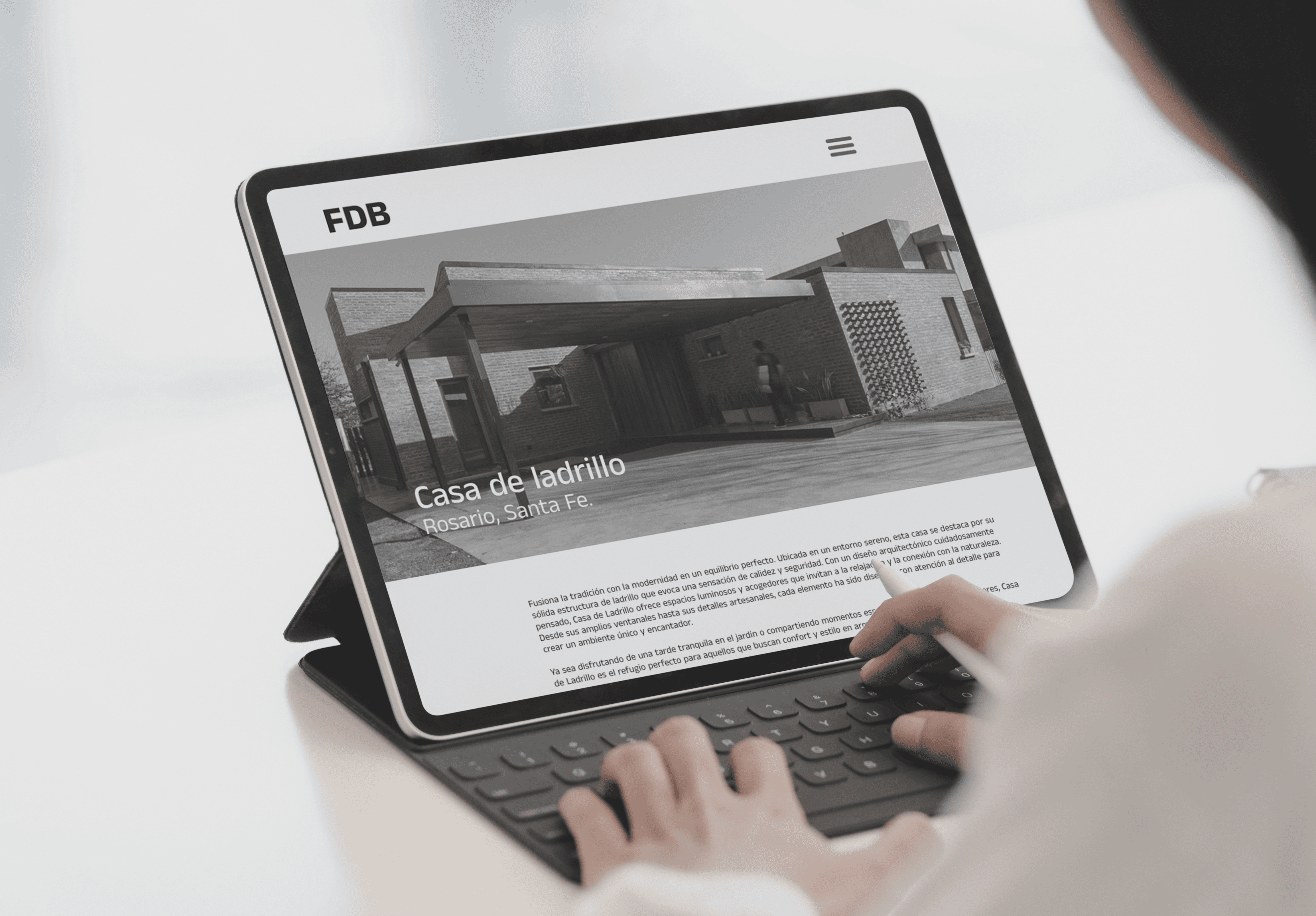 Modern architecture studio website design displayed on an iPad Pro with a Magic Keyboard and Apple Pencil.