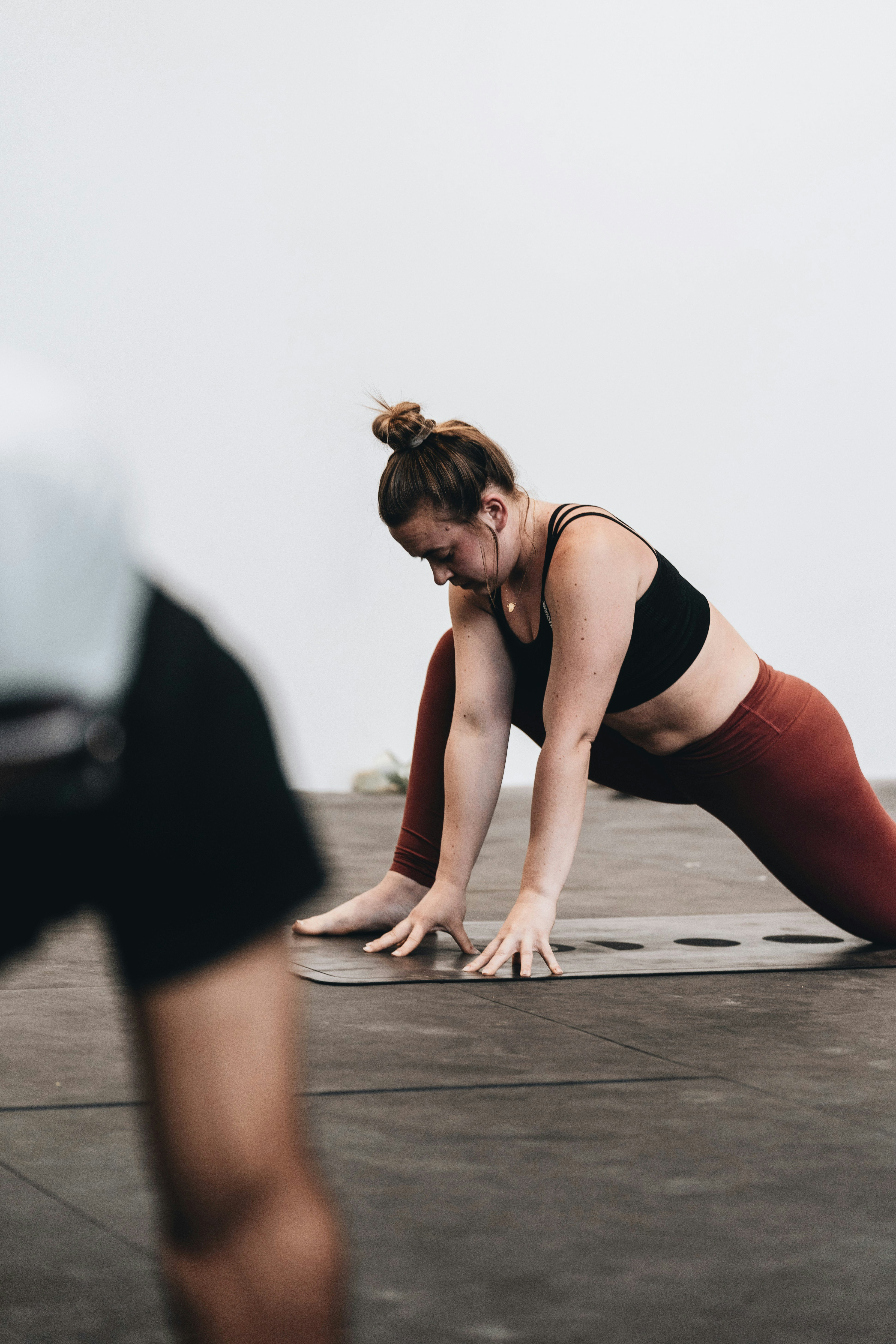 a woman stretching after finishing her workout