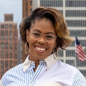 Possible member smiling and looking at the camera.