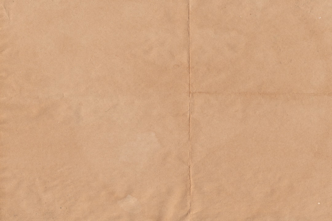 a piece of brown paper with a white background