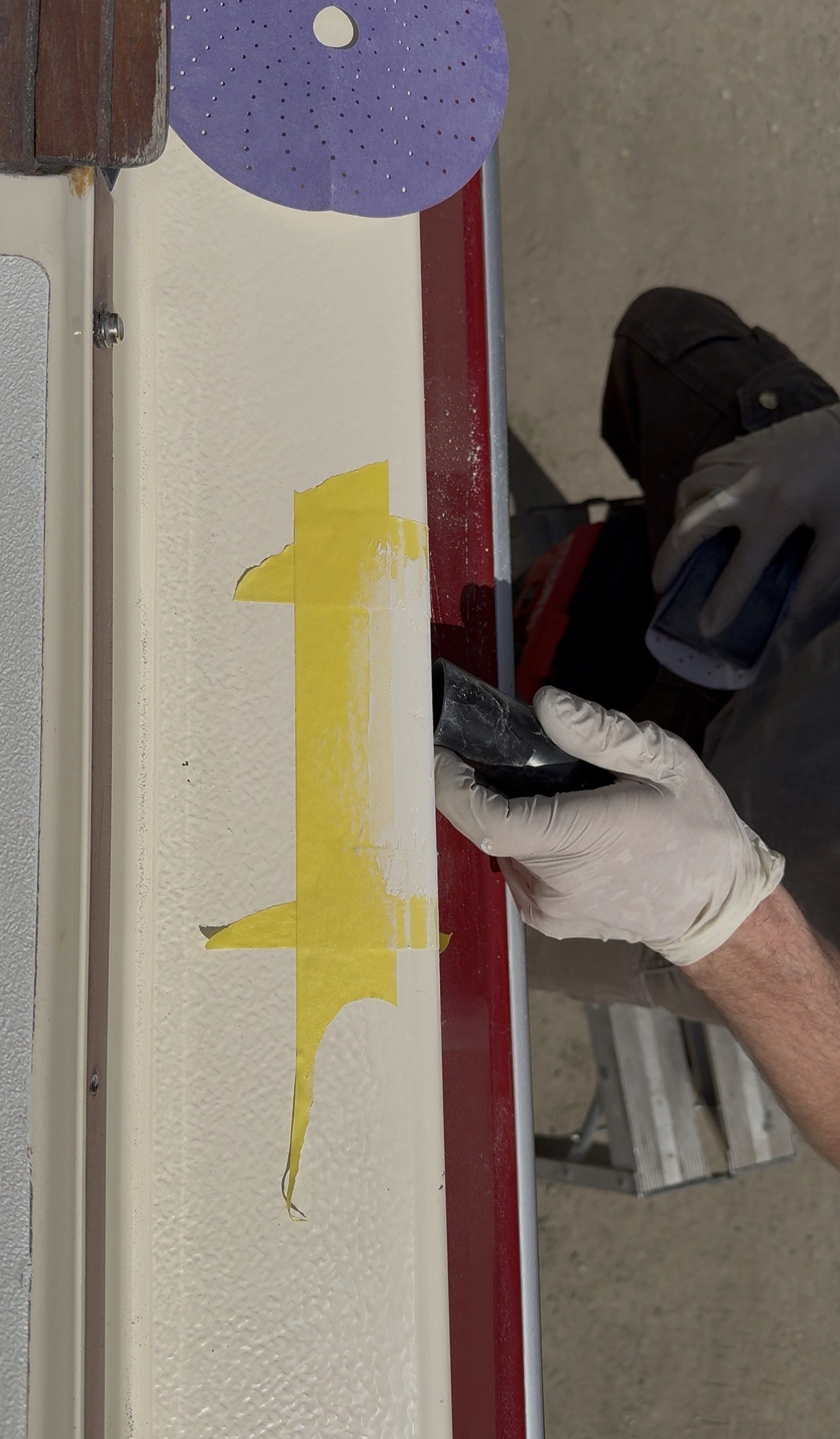 A marine gel coat repair being worked on