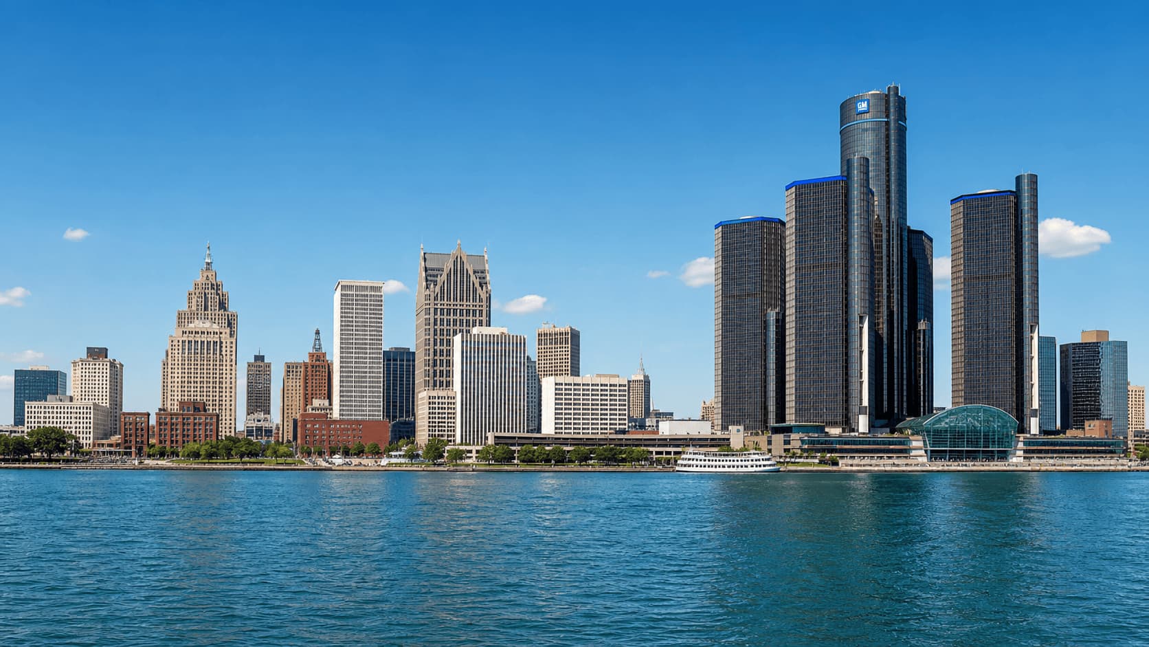 Detroit skyline with riverfront and modern buildings under clear sky