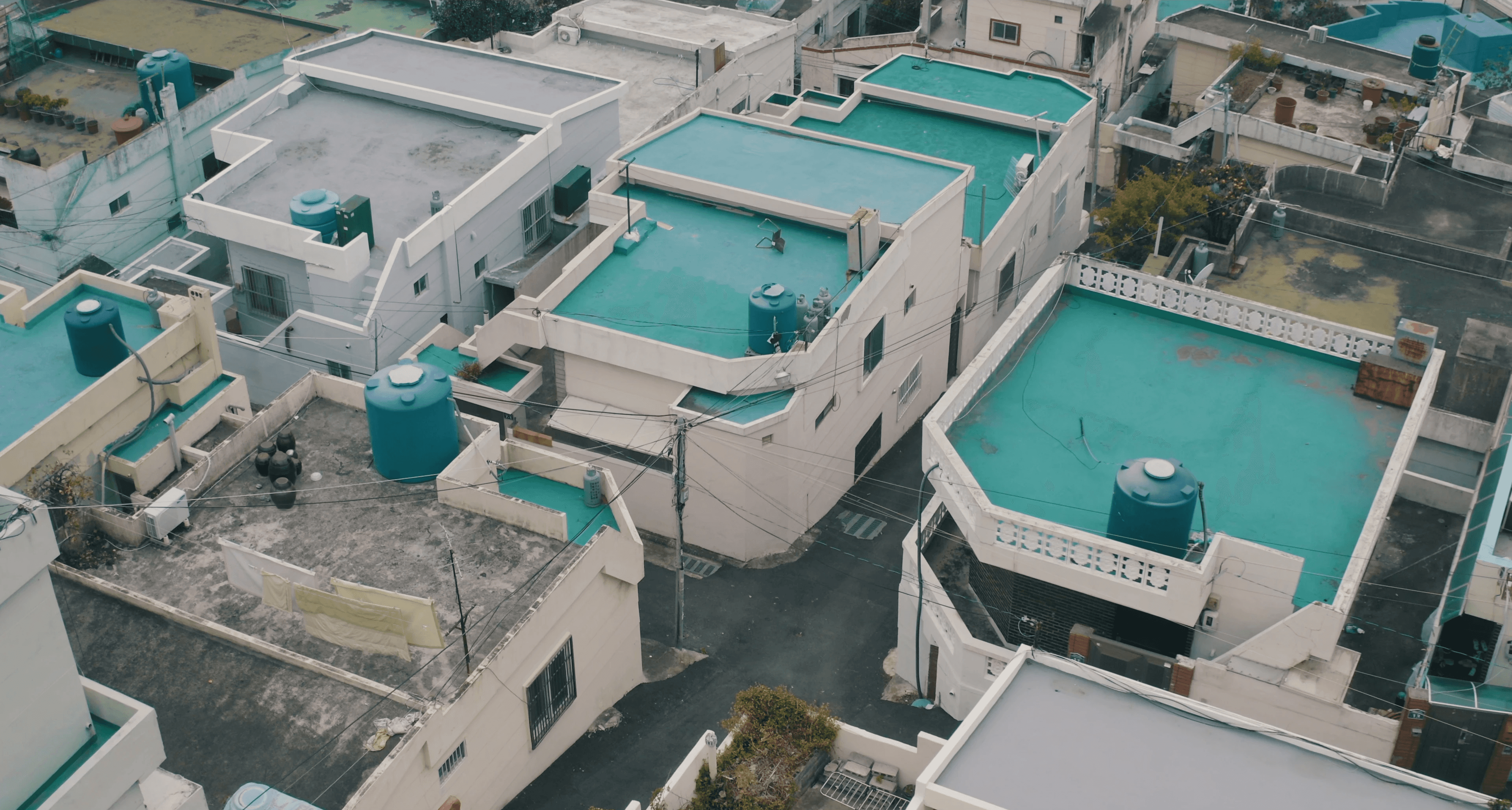 Sunlight casting shadows through orange blinds